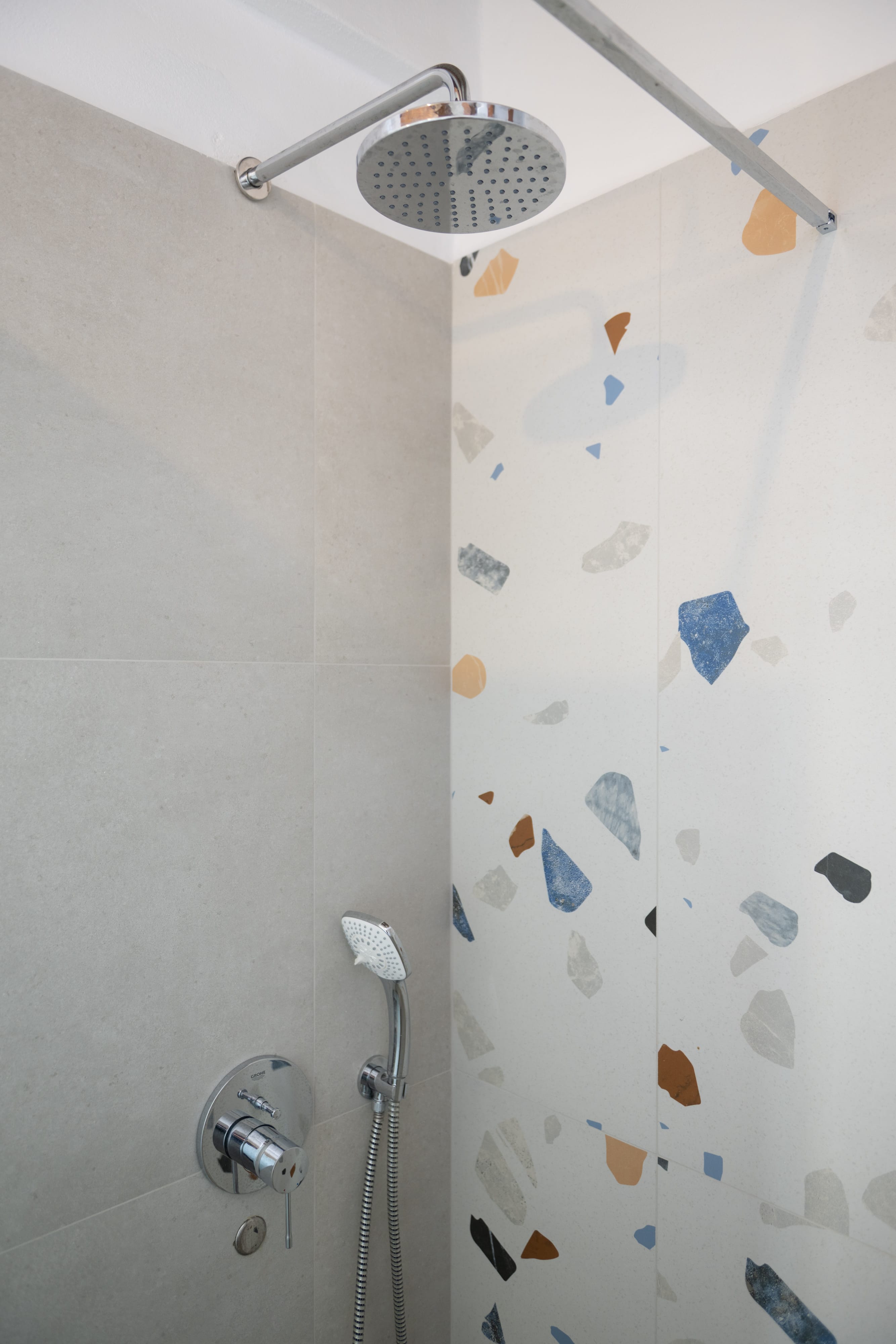 a shower head and shower head in a bathroom