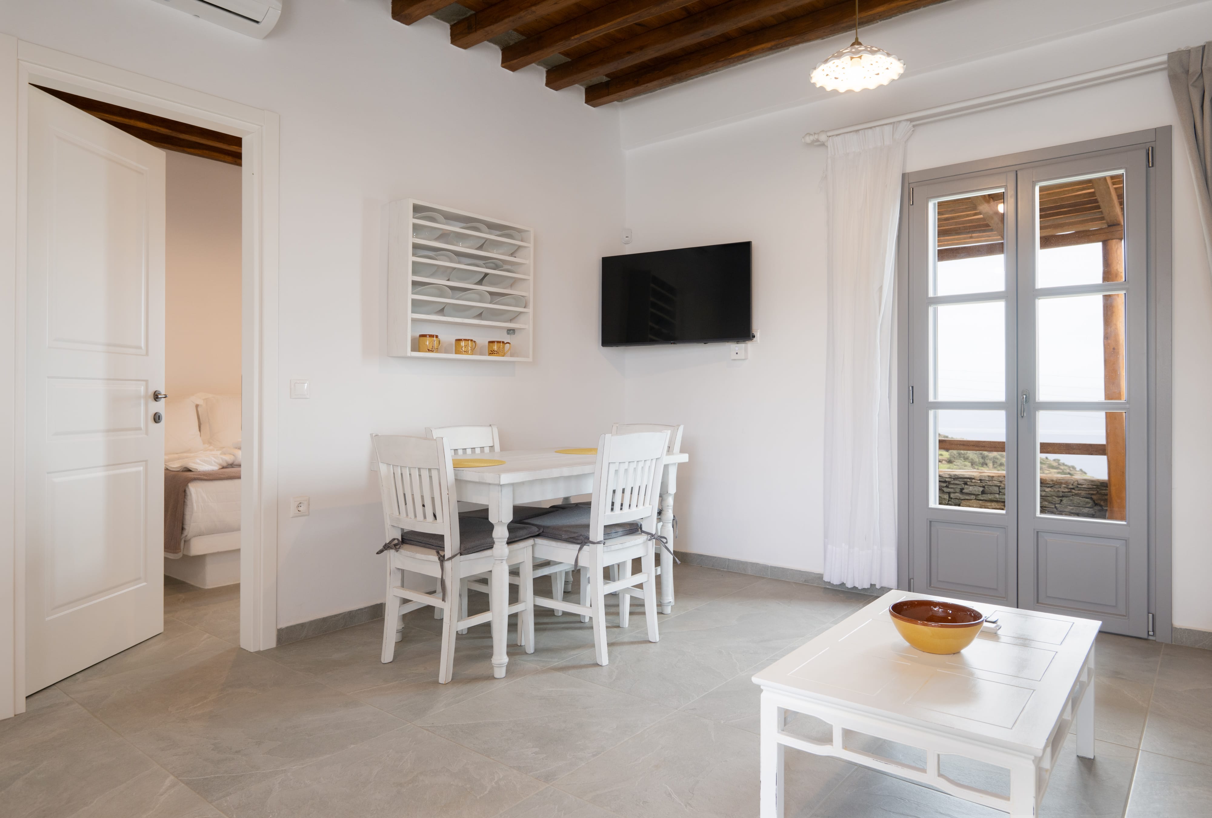 a room with a table and chairs
