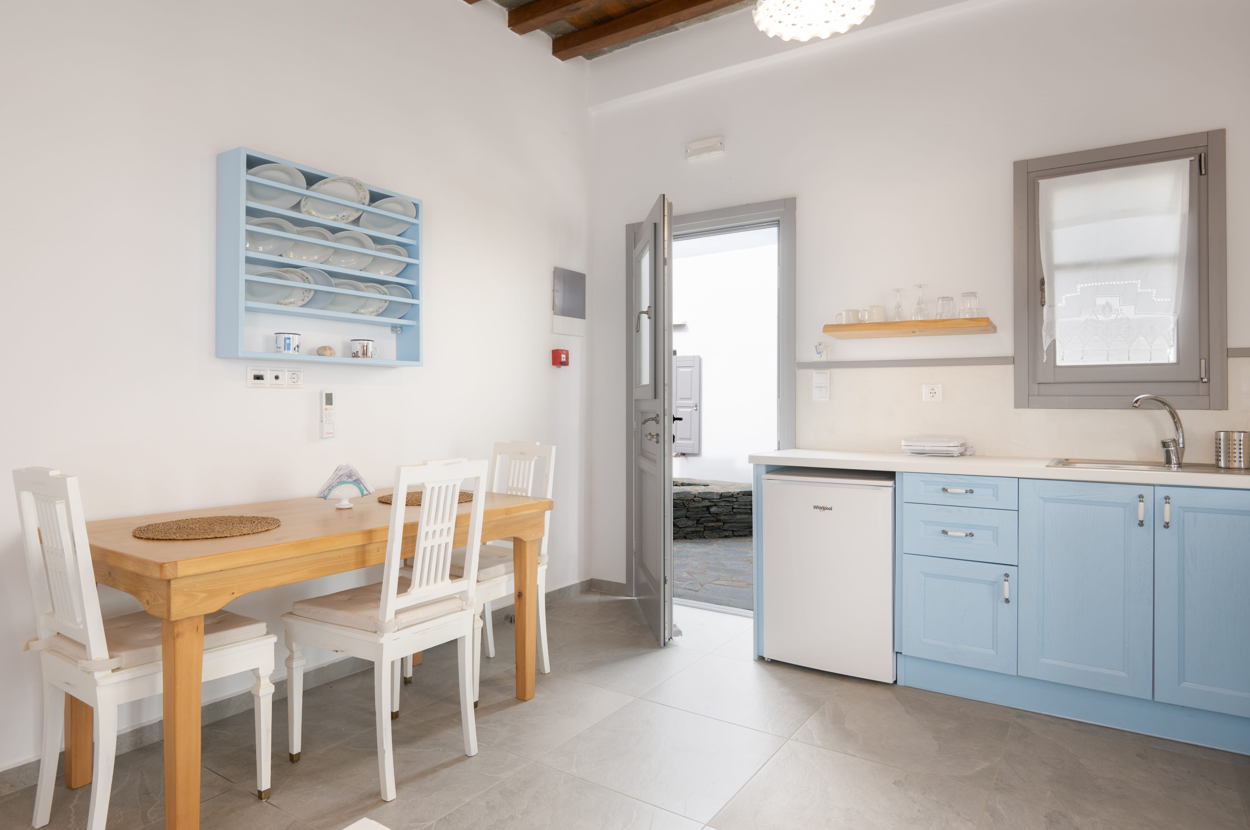 a kitchen with a table and chairs