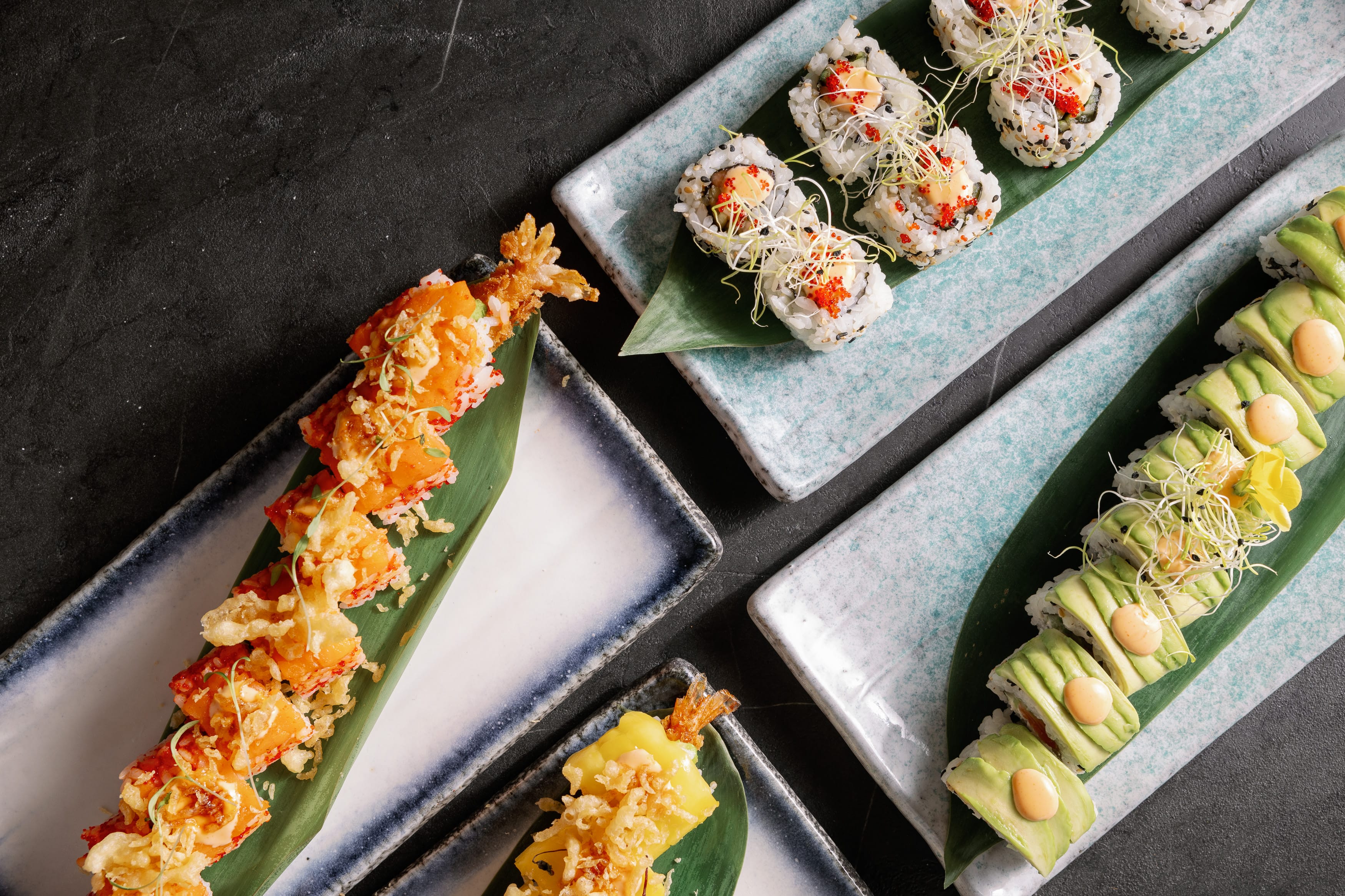 a group of sushi rolls