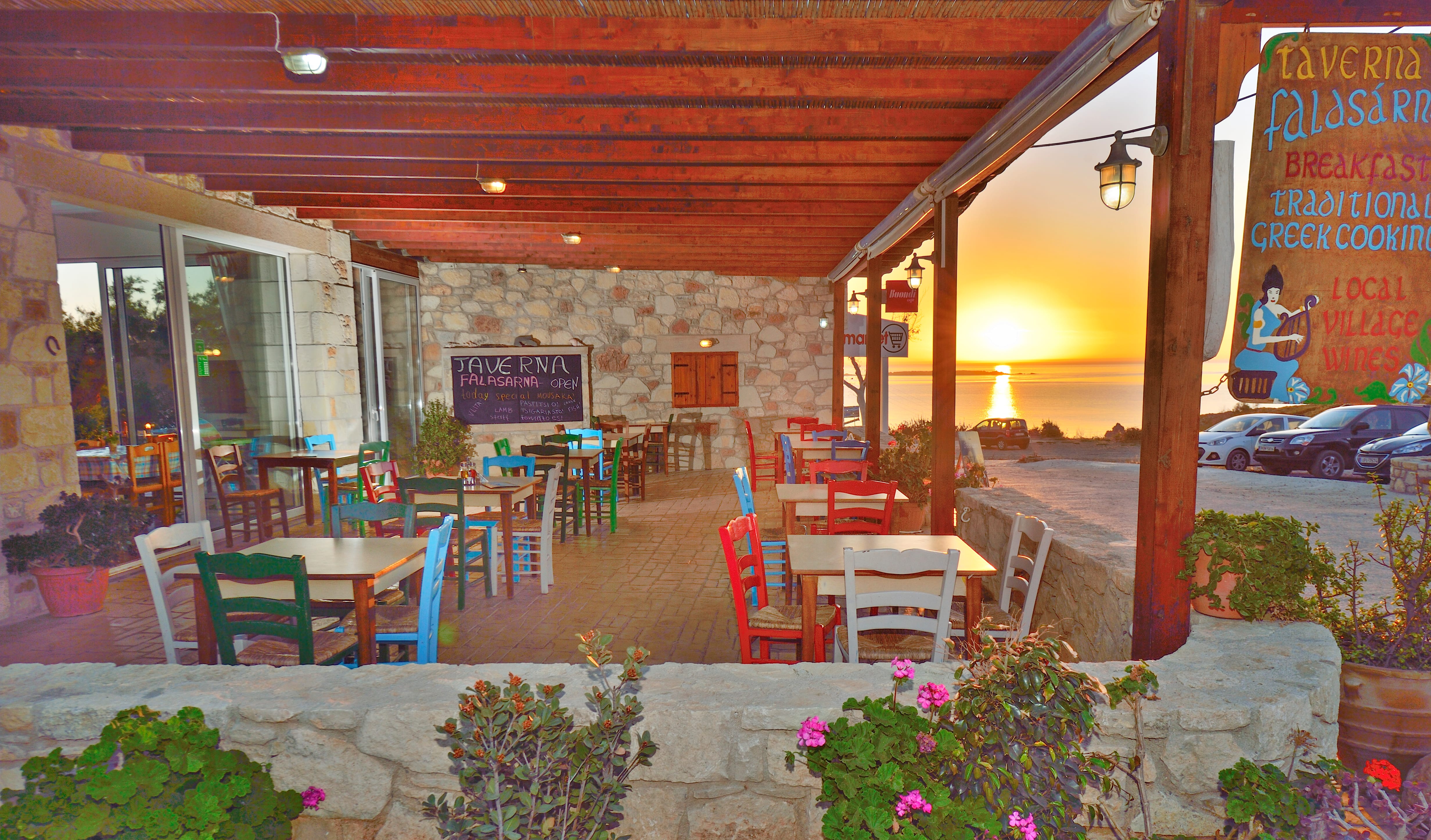a patio with tables and chairs