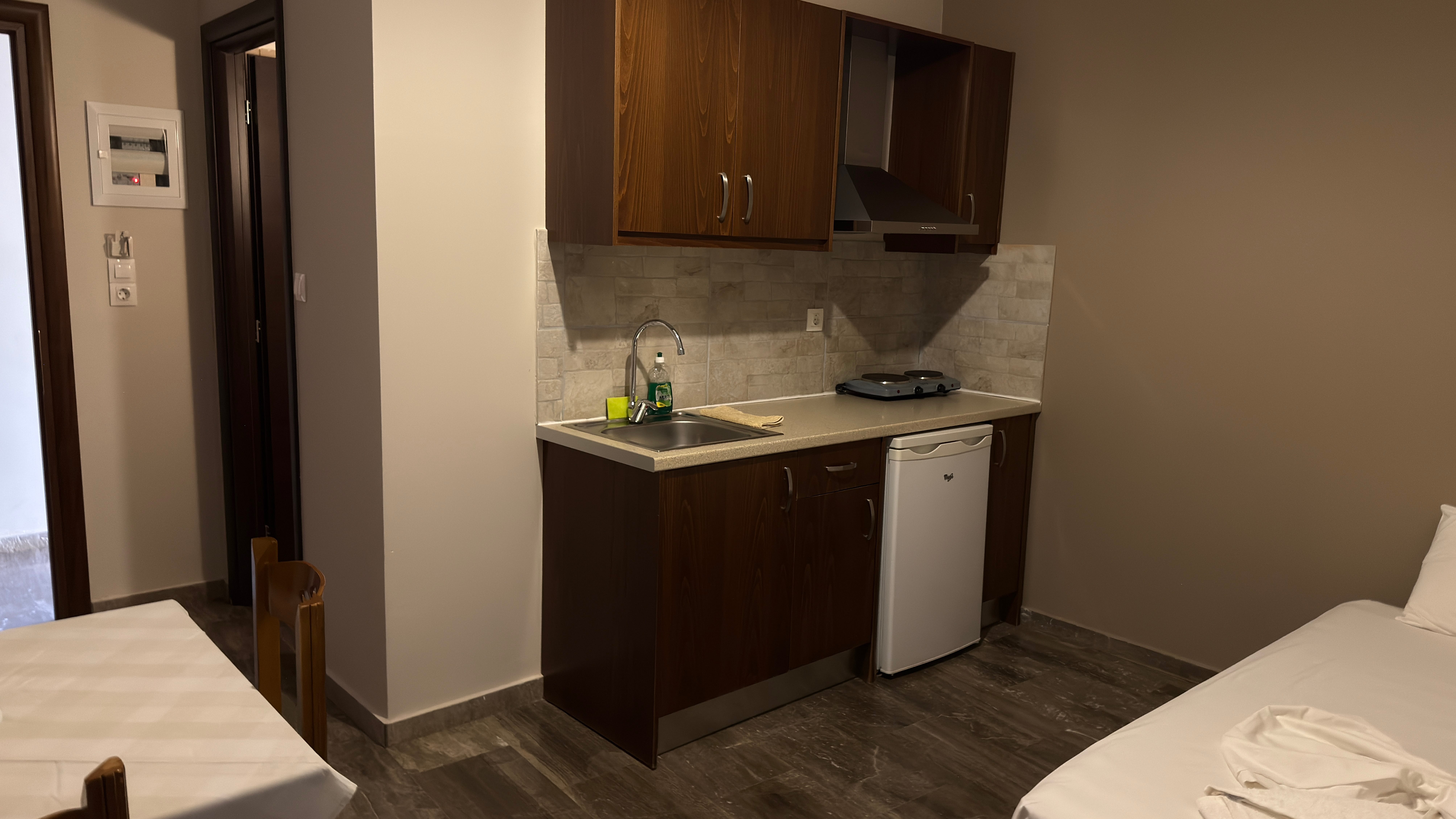 a kitchen with a sink and cabinets