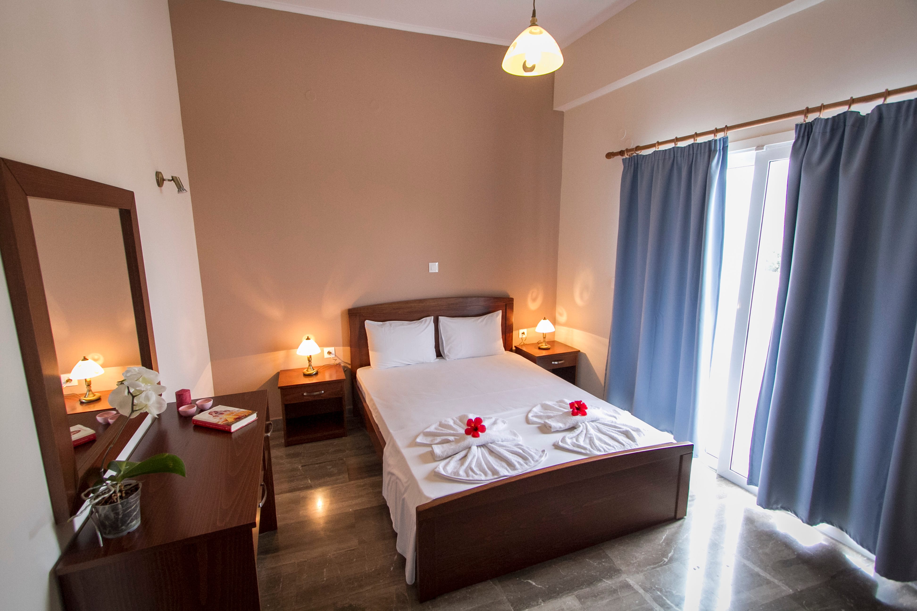 a bedroom with a bed and a mirror