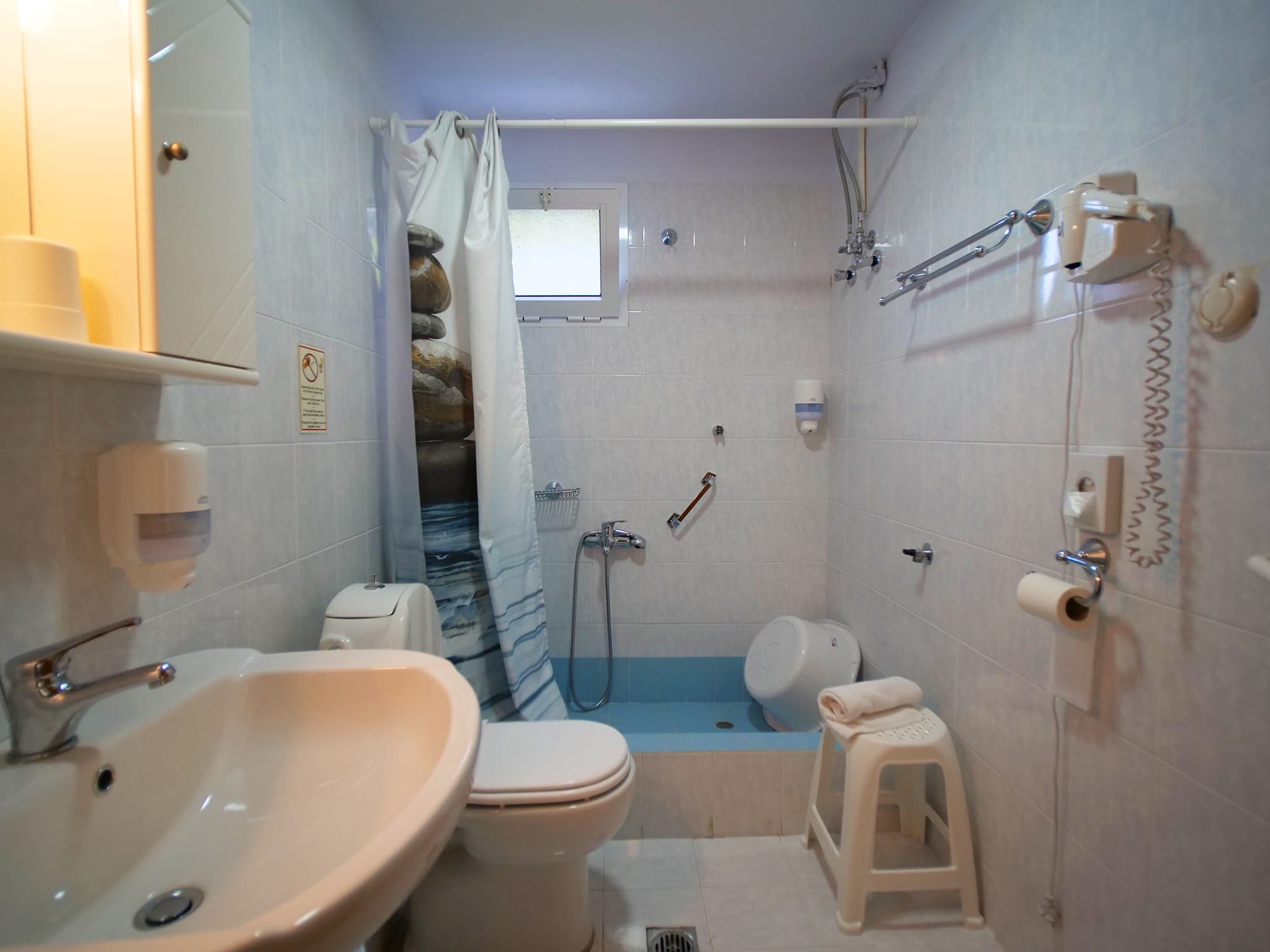 a bathroom with a sink and toilet