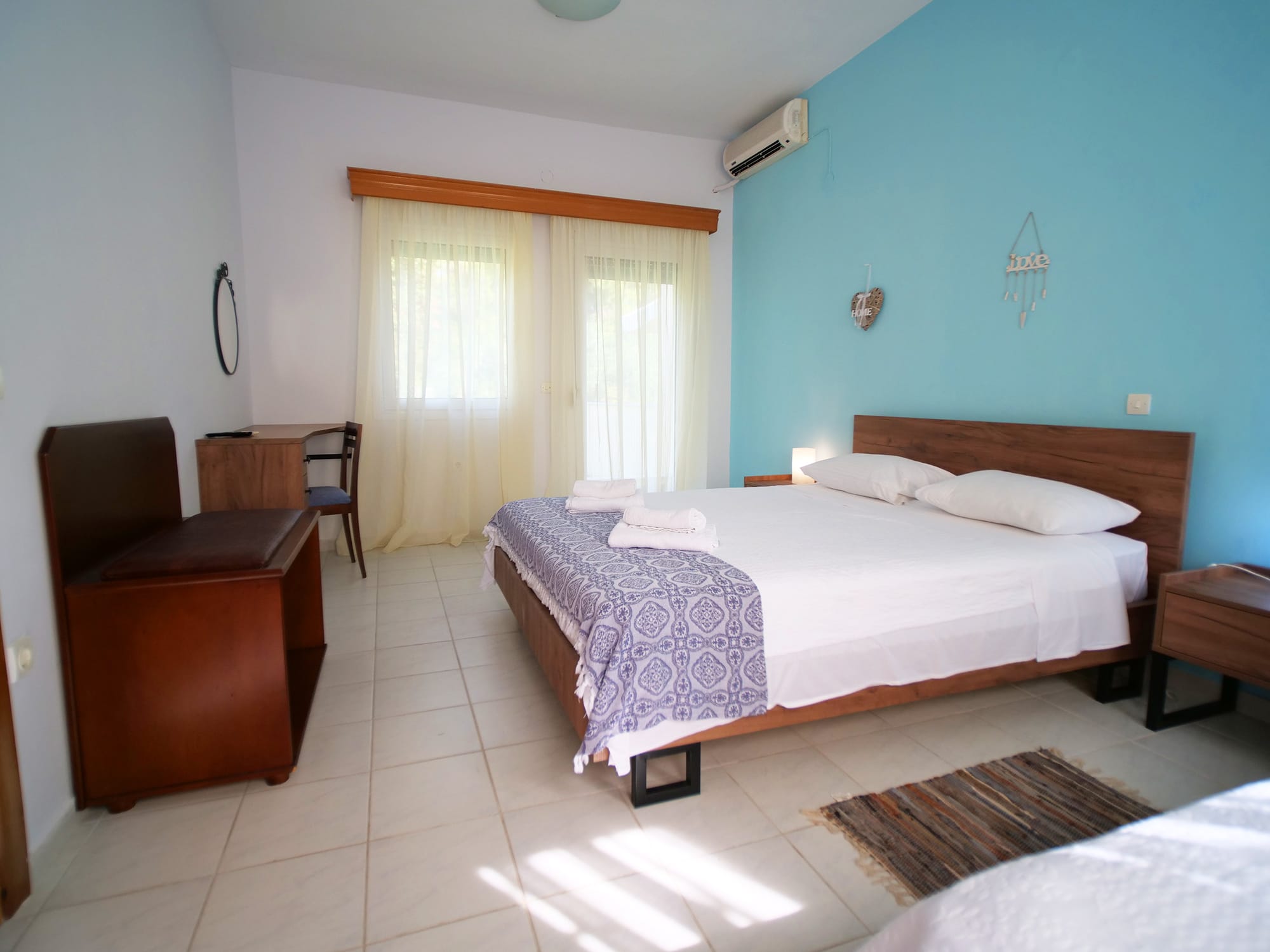 a bedroom with a bed and a chair