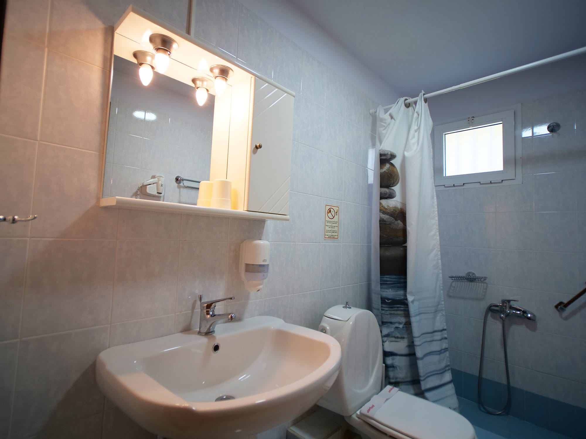 a bathroom with a sink and mirror