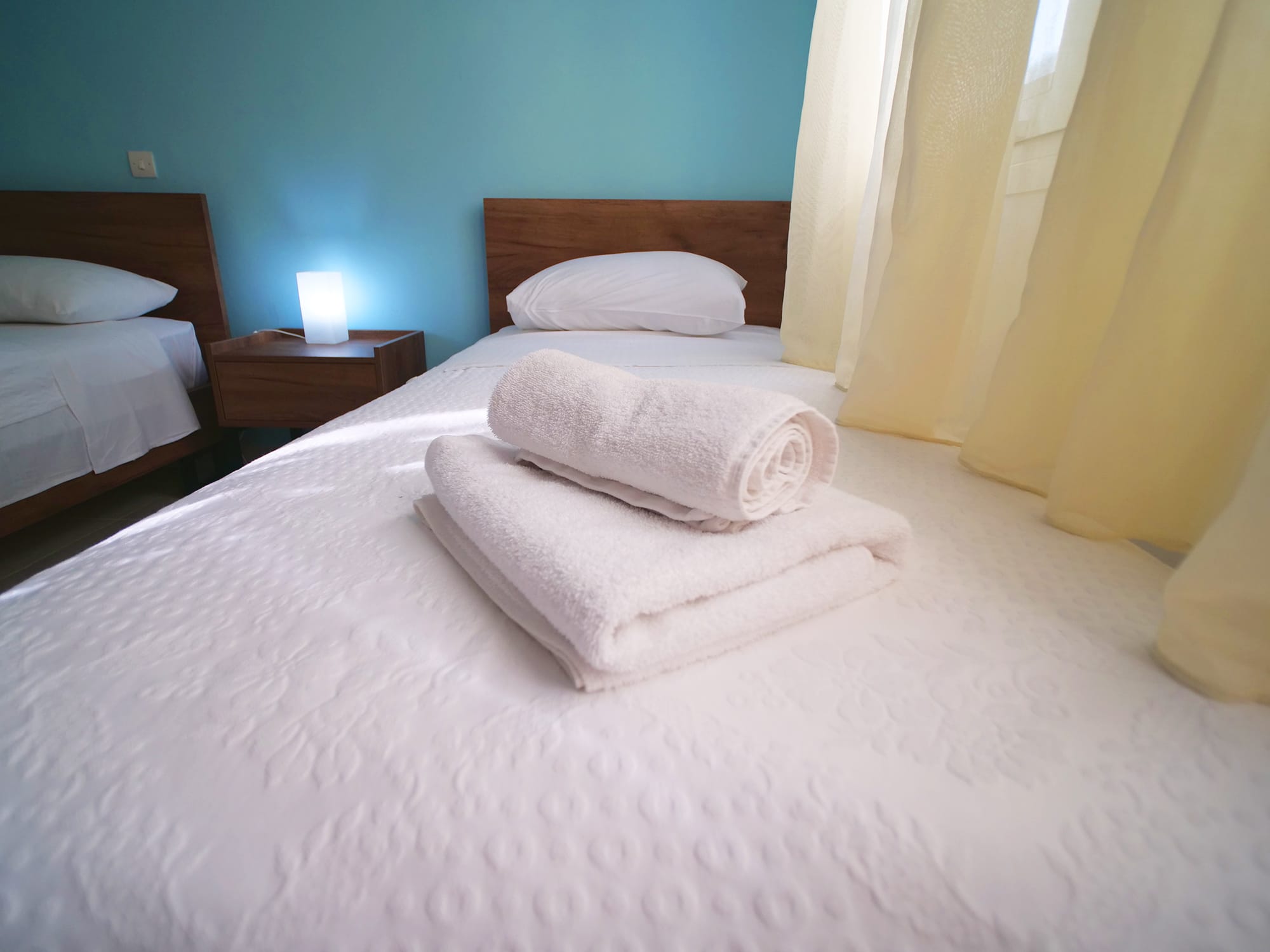 a bed with white towels on it