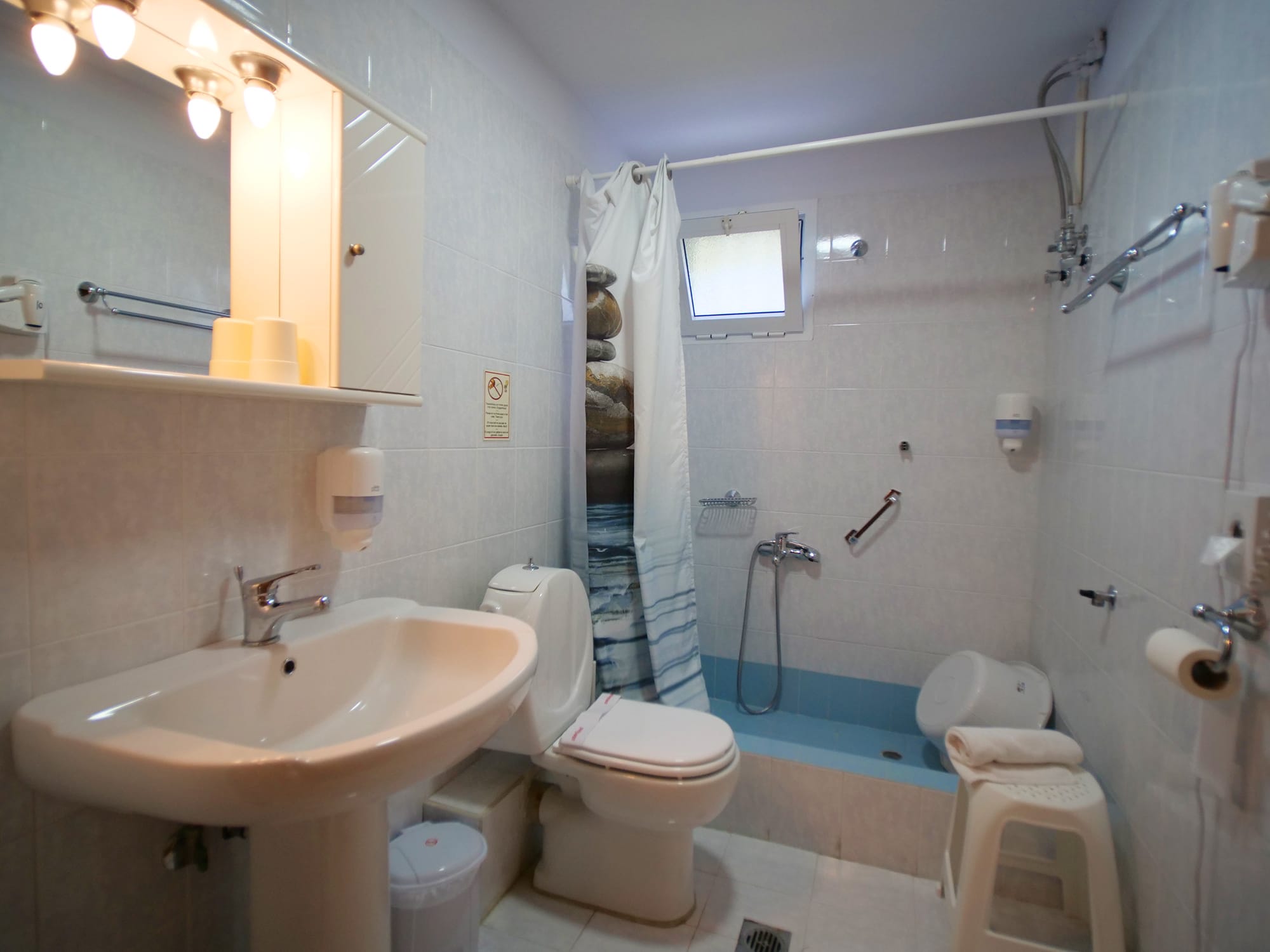 a bathroom with a toilet and sink