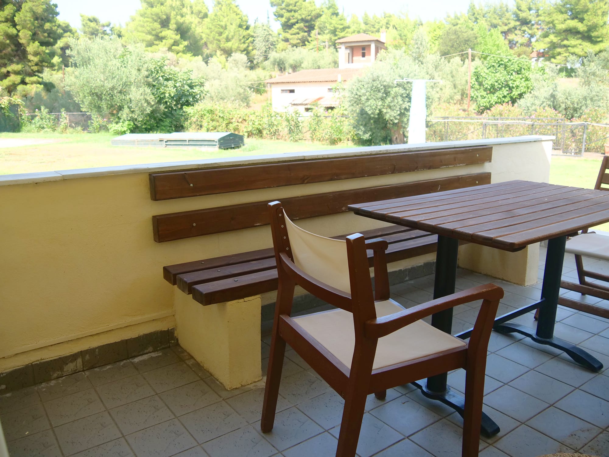a table and chairs on a balcony