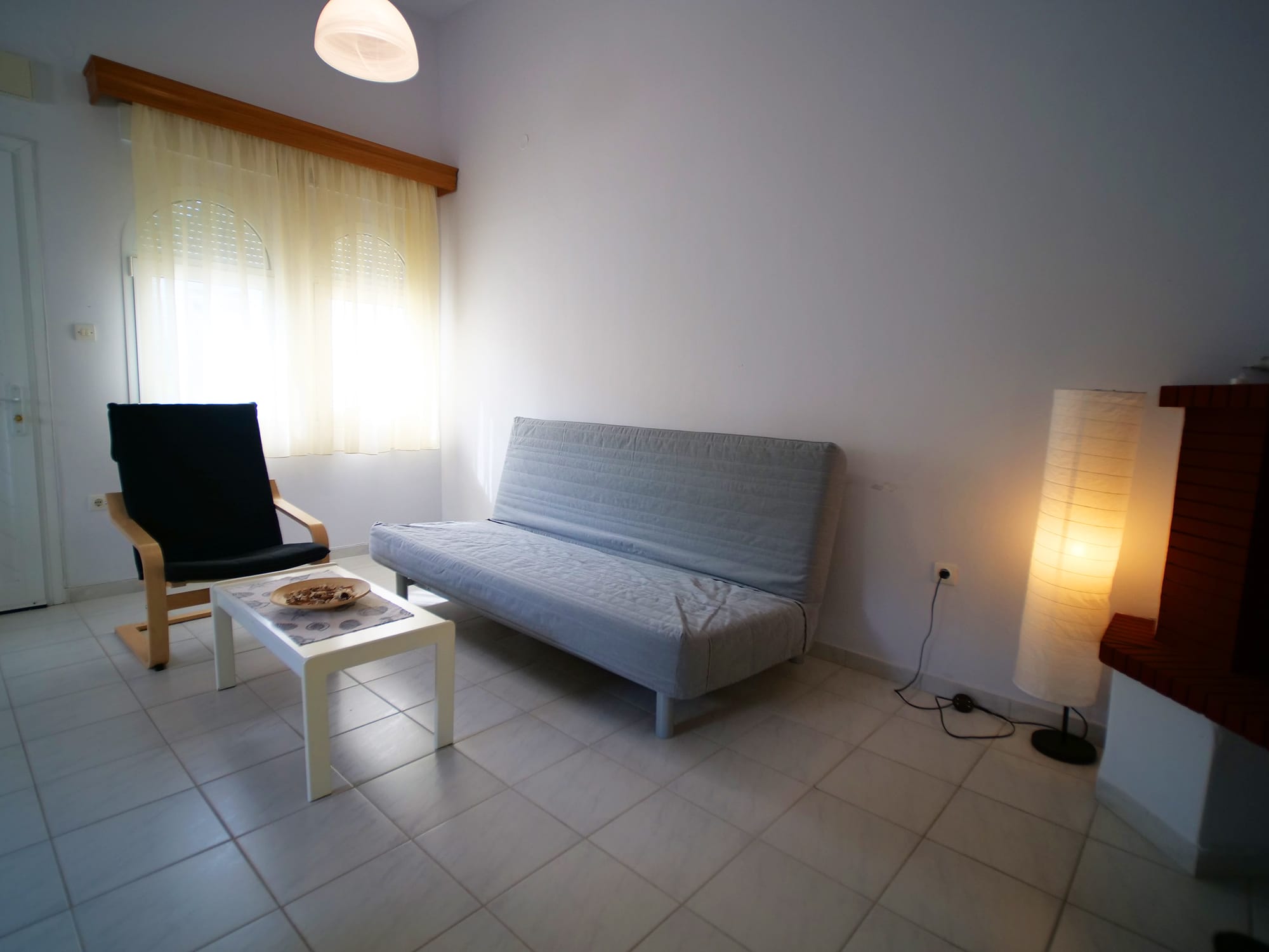 a living room with a couch and a table