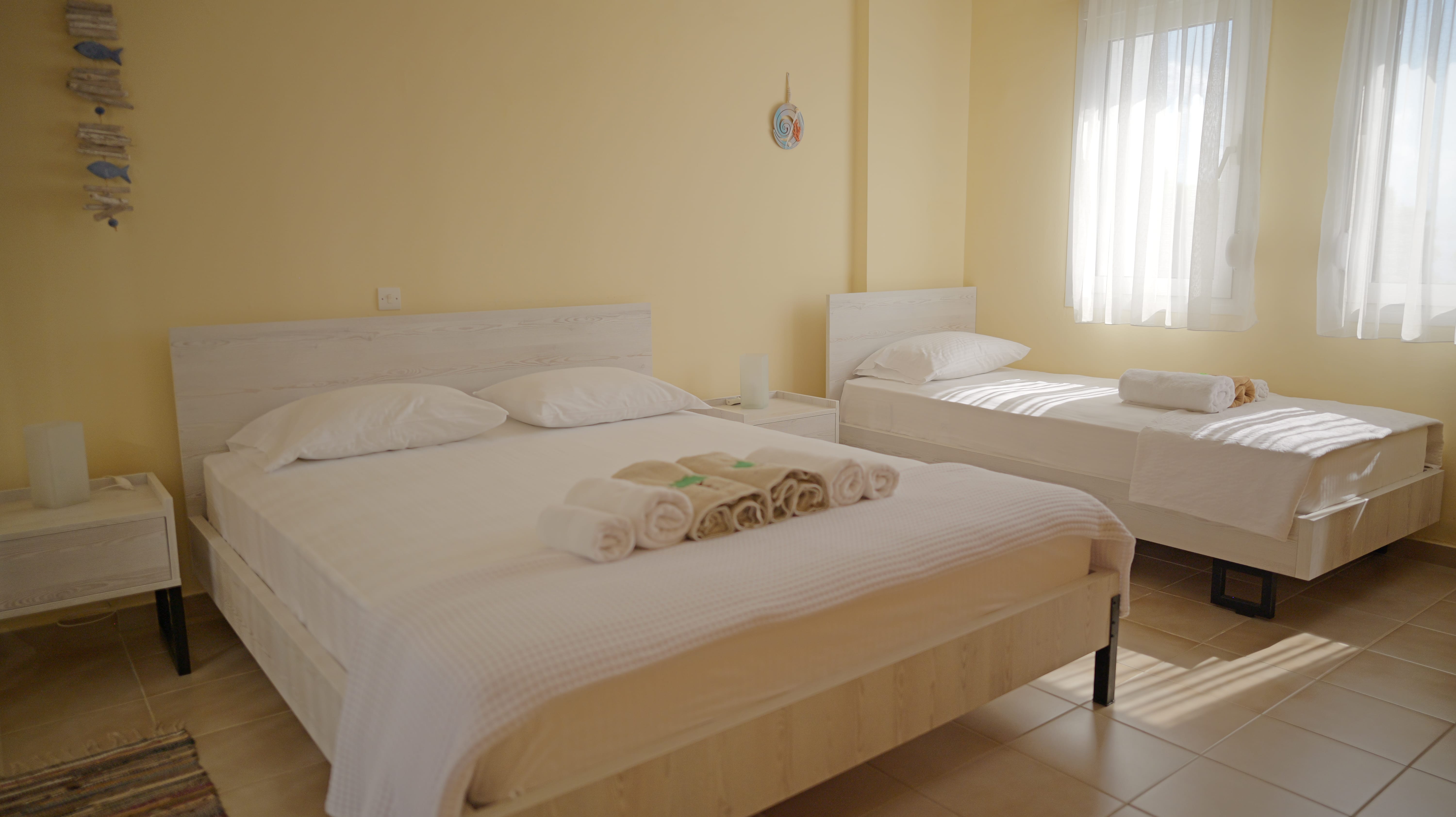 a couple of beds in a room
