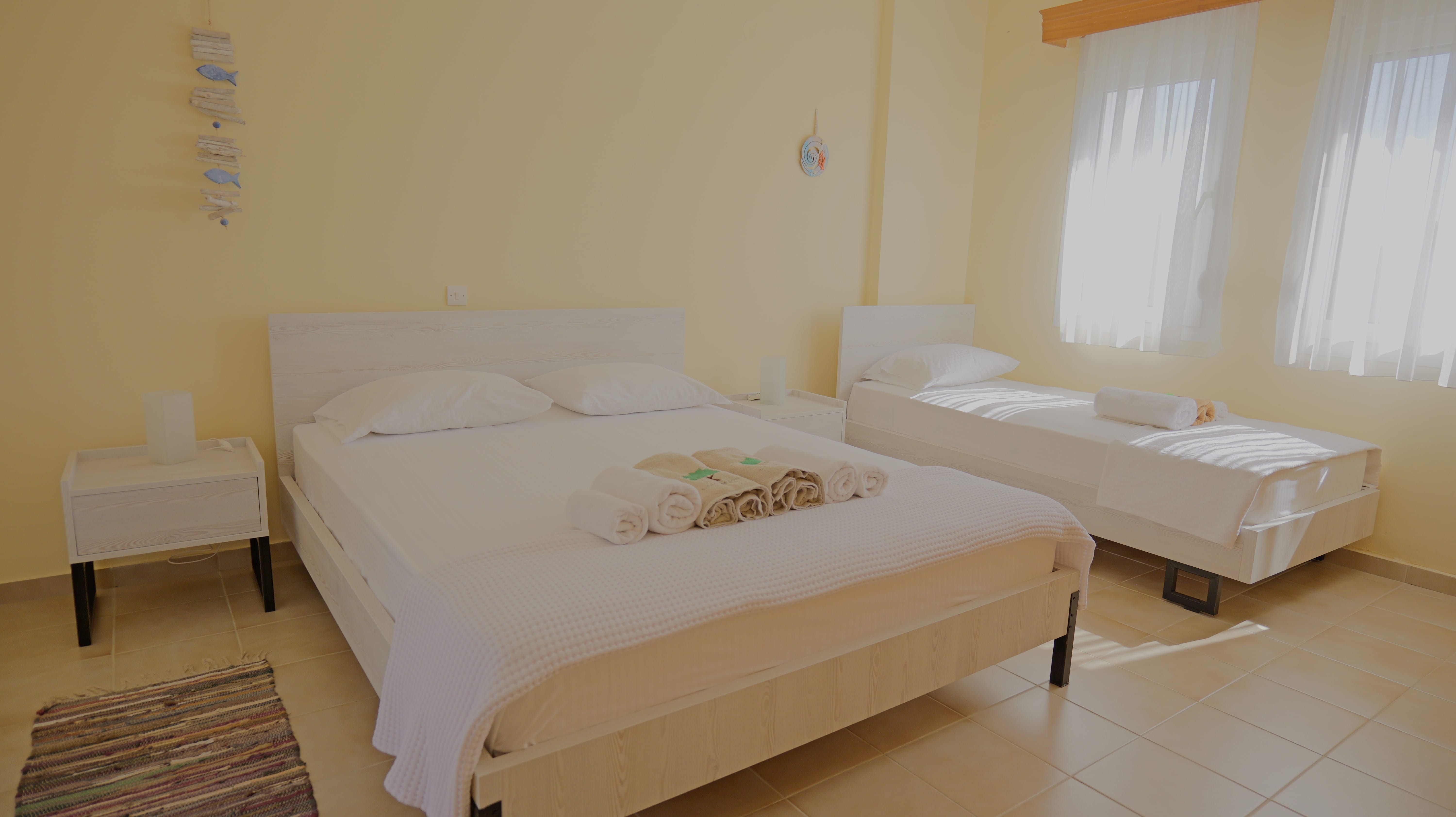 a couple of beds in a room