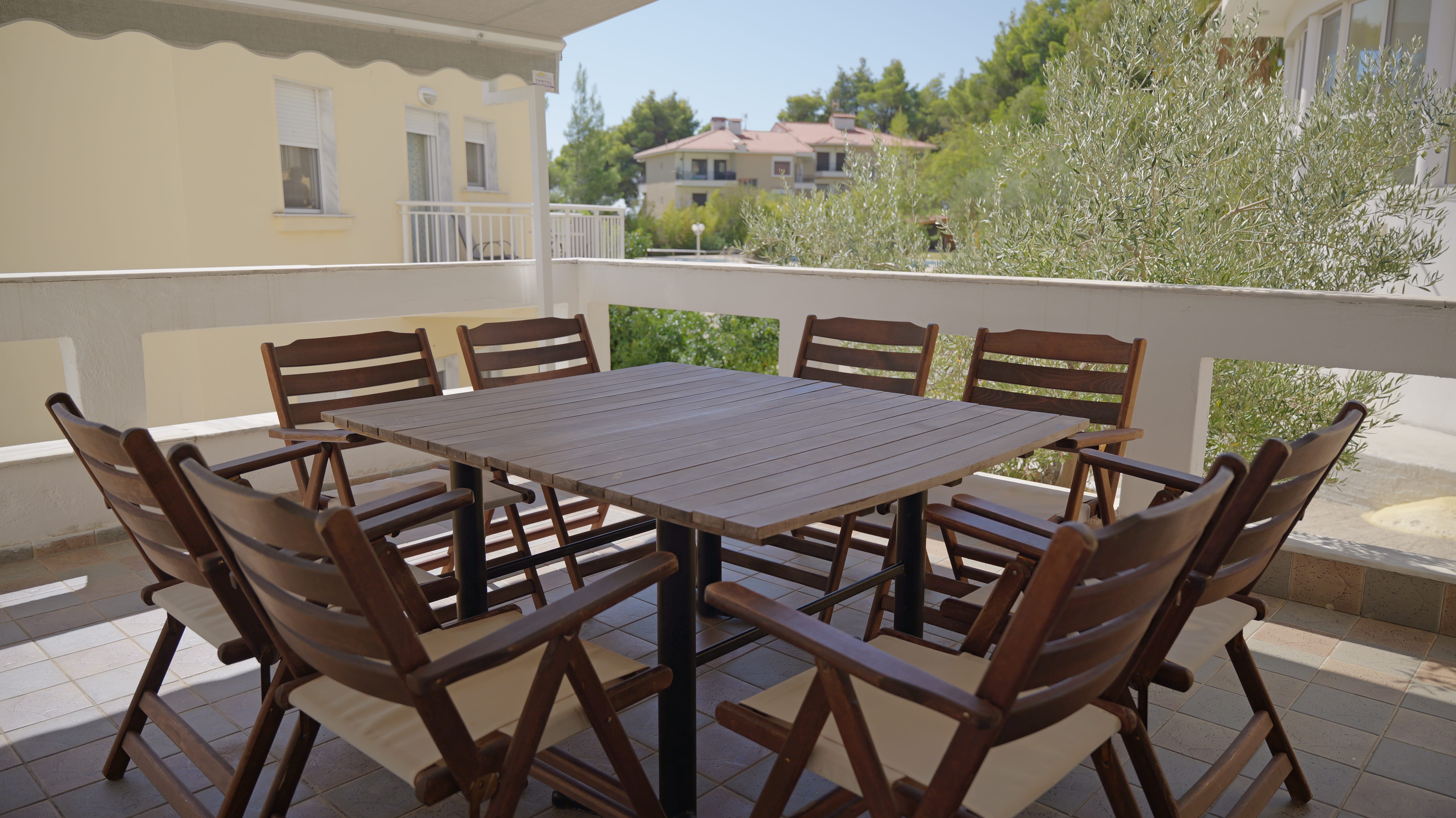 a table and chairs on a deck