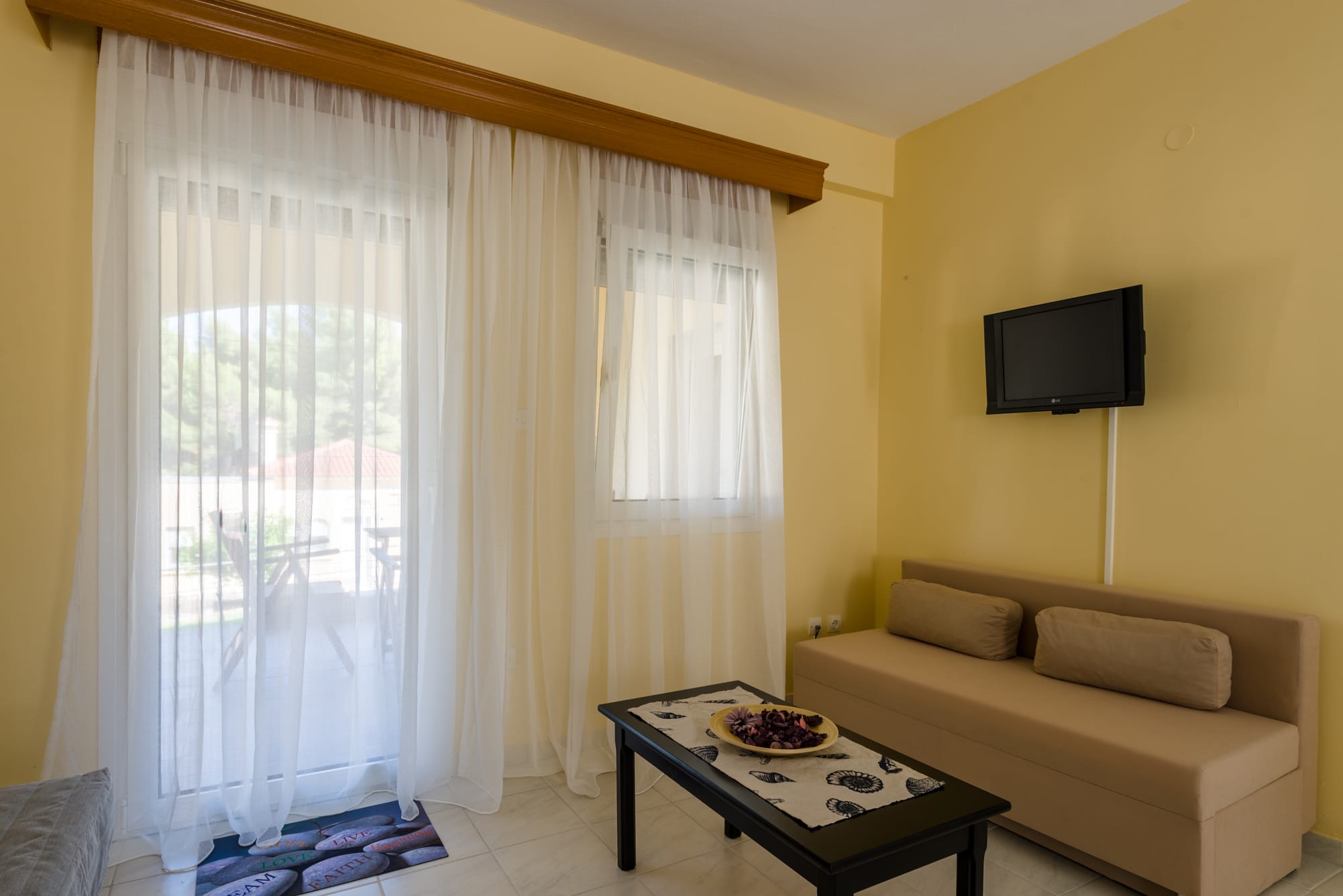 a living room with a couch and tv