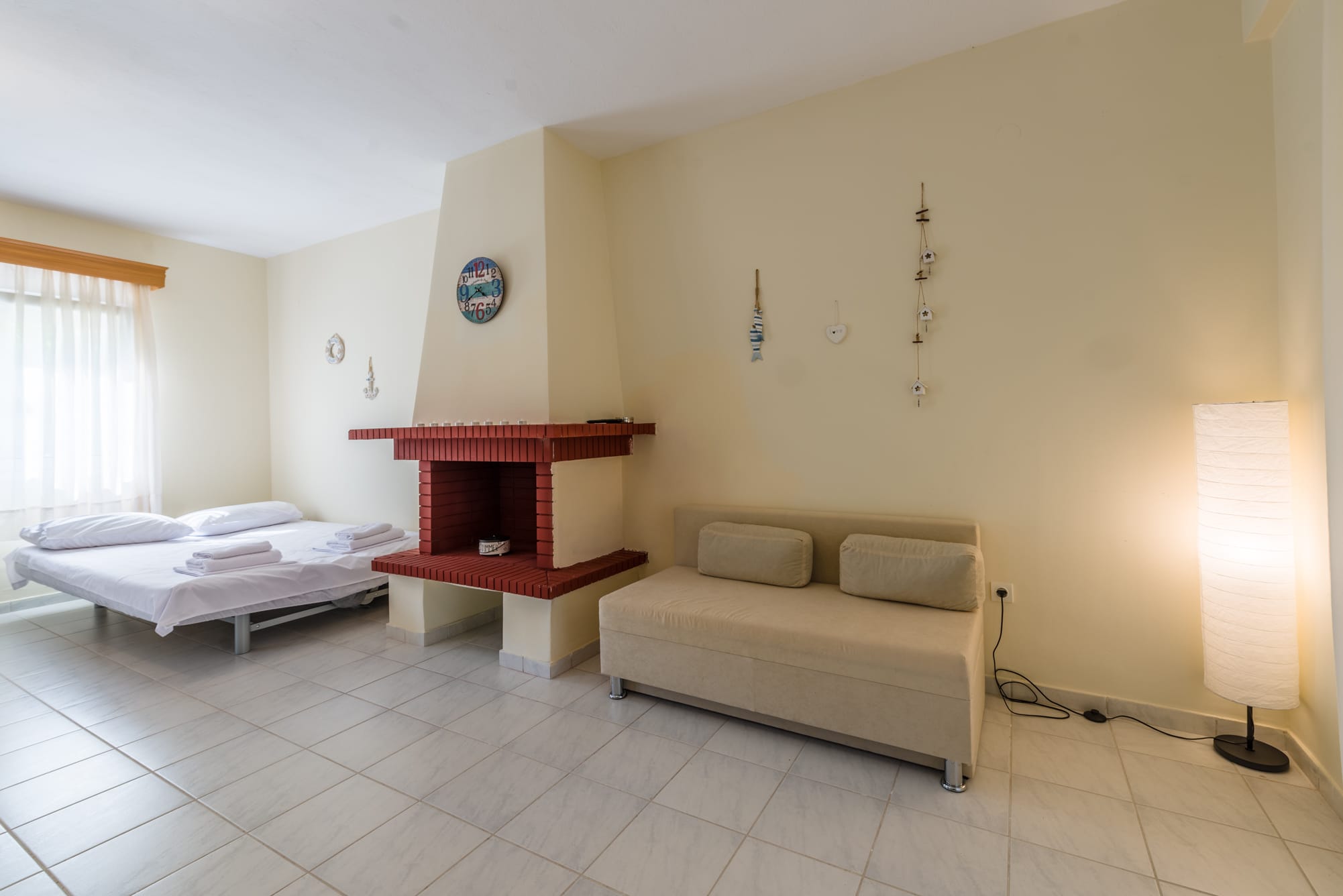 a room with a bed and a fireplace