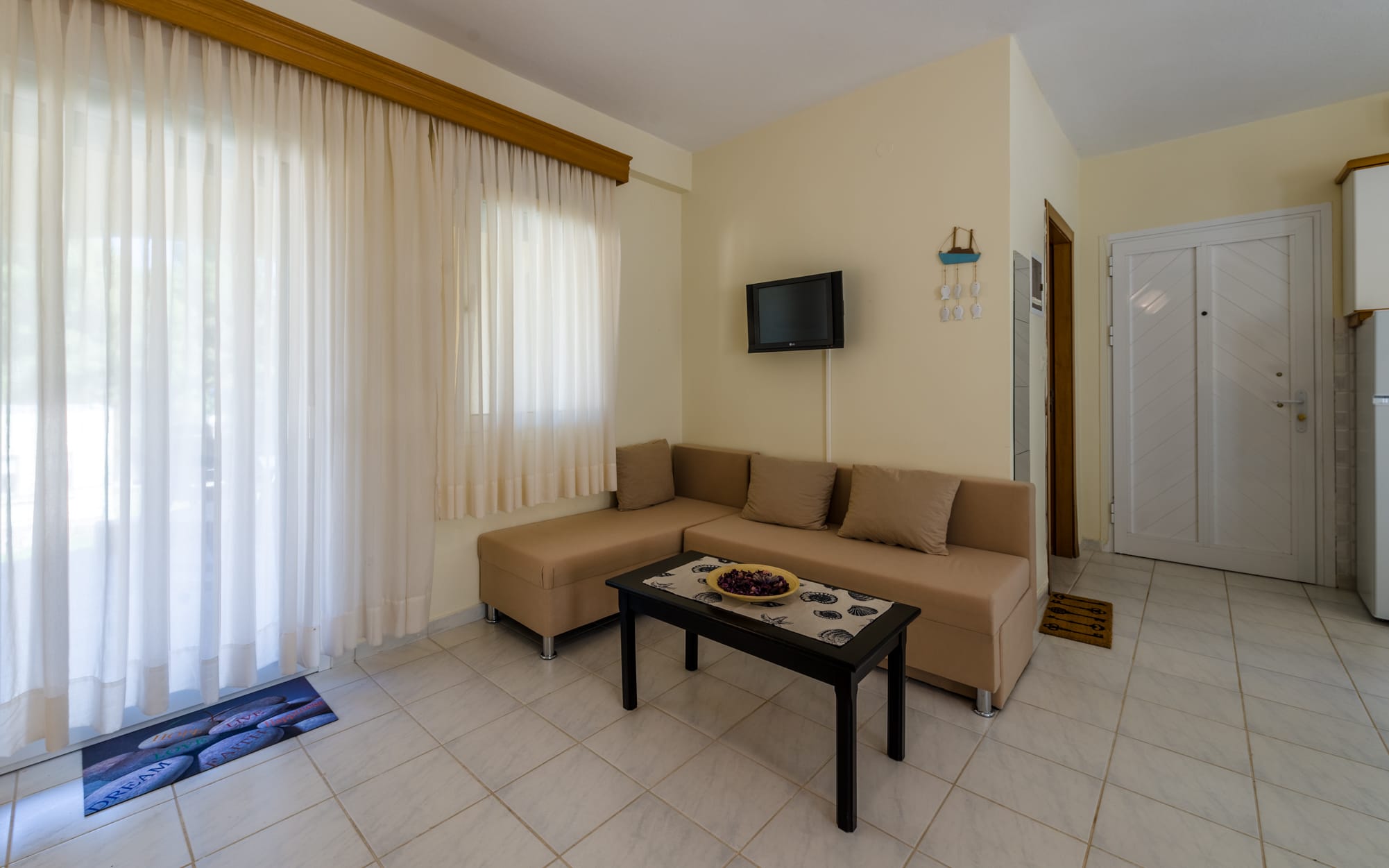 a living room with a couch and a tv