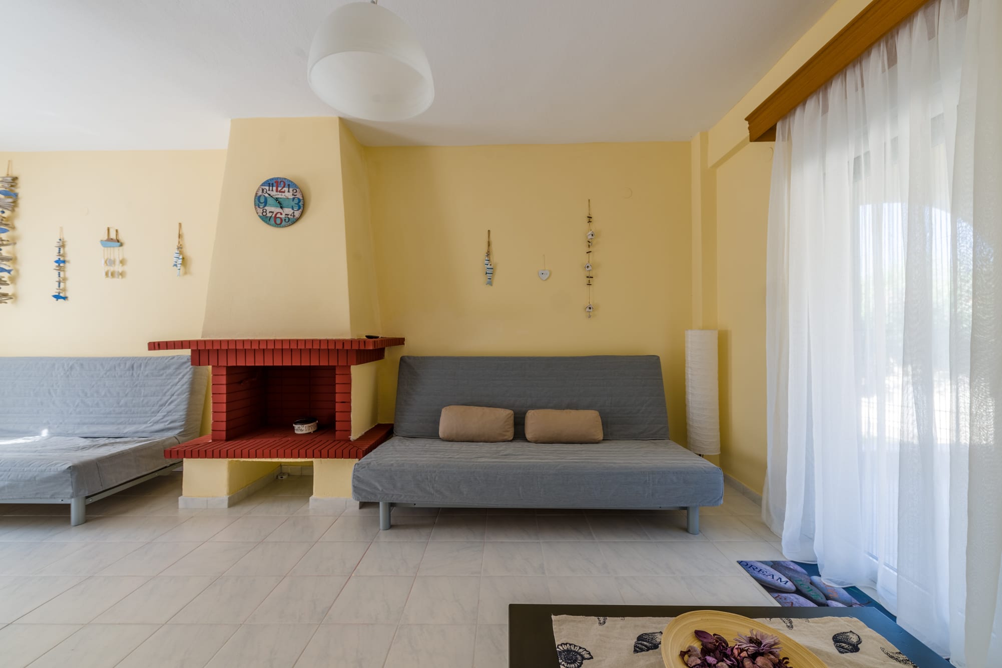 a room with a couch and fireplace