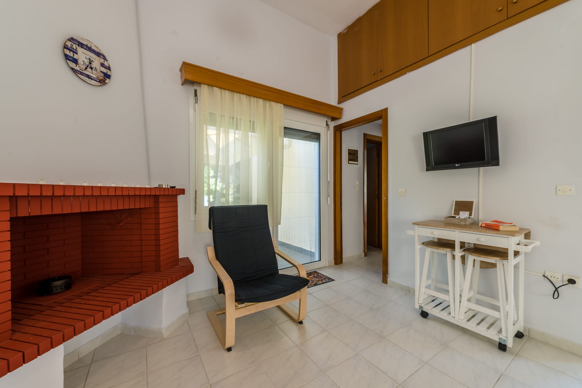 a room with a fireplace and a chair