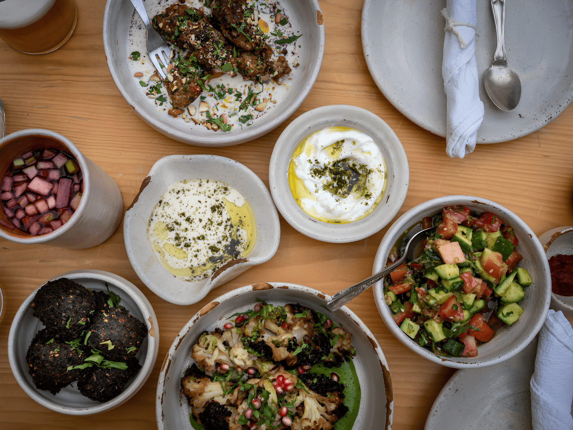 a table full of bowls of food