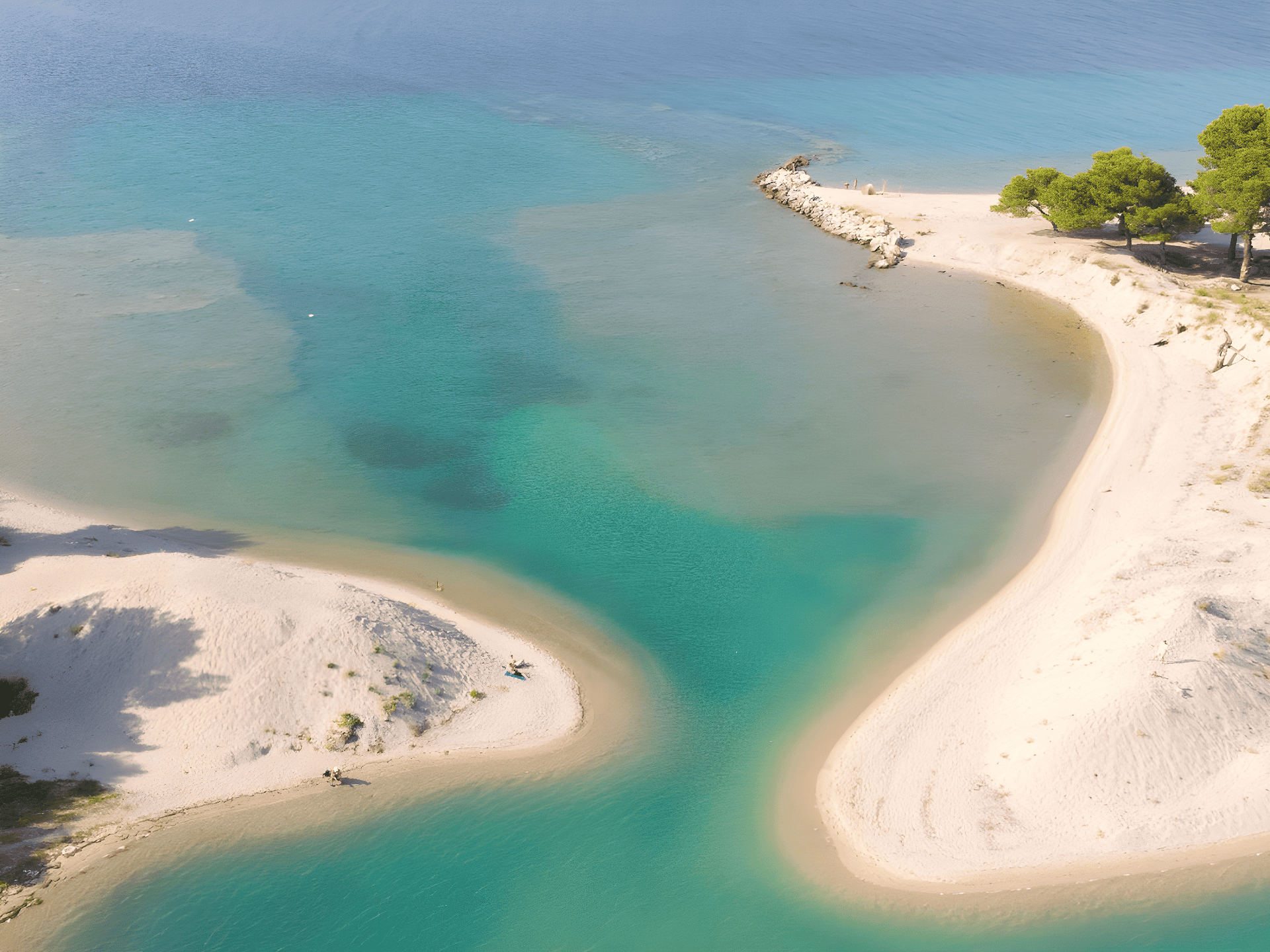 a beach with clear blue water