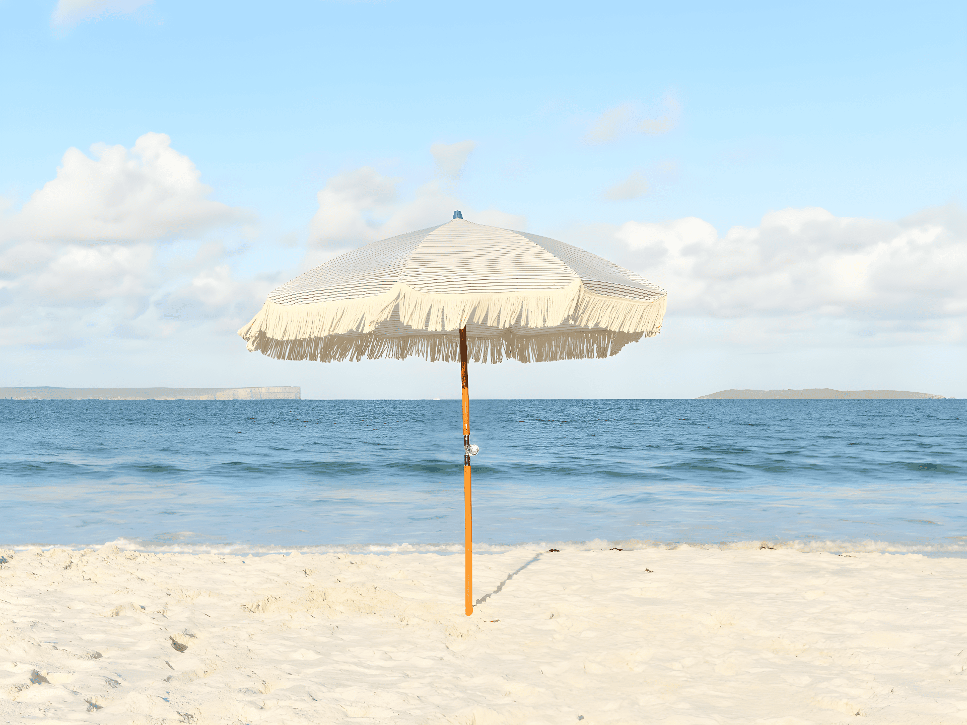 a white umbrella on a beach