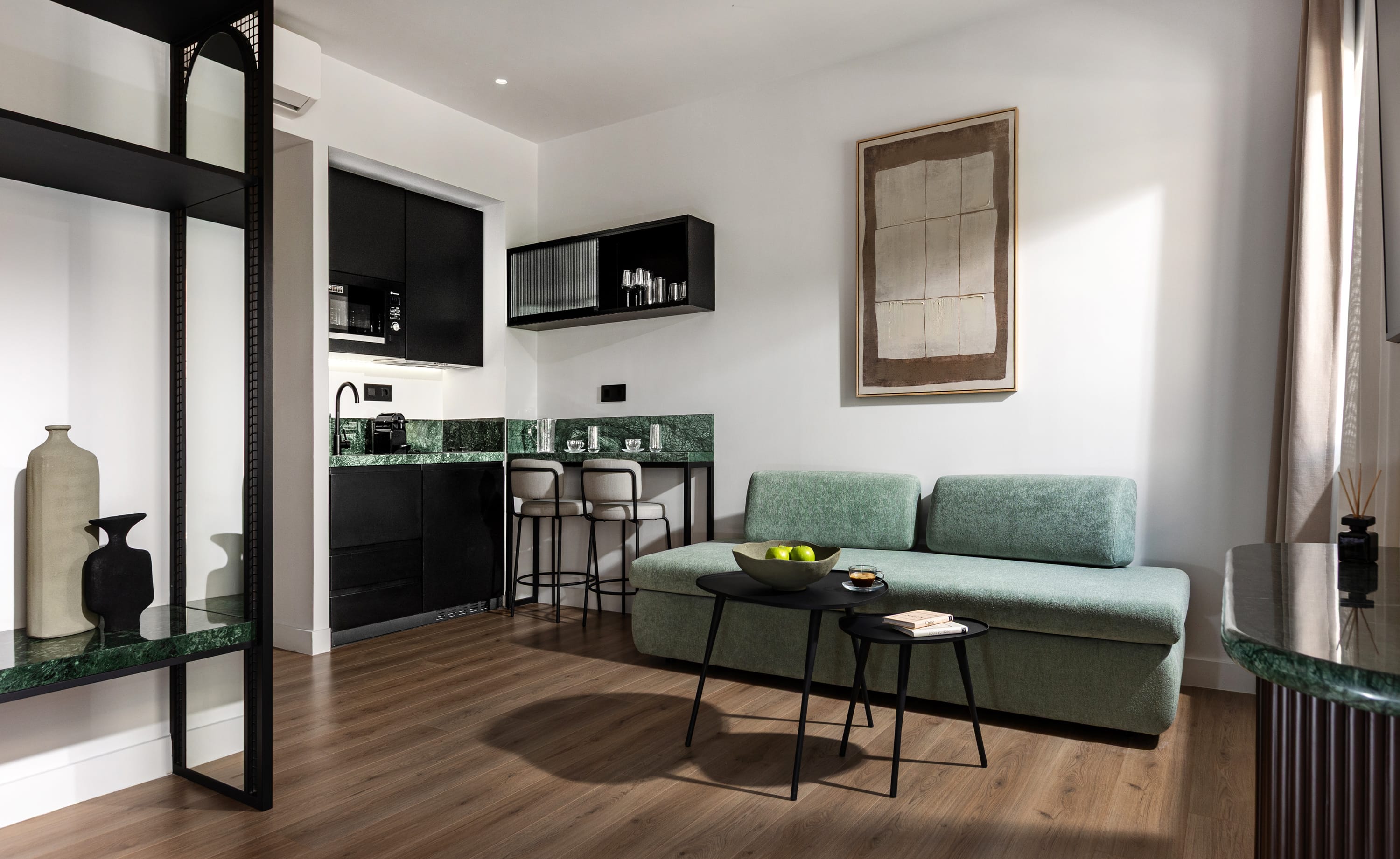 a living room with a green couch