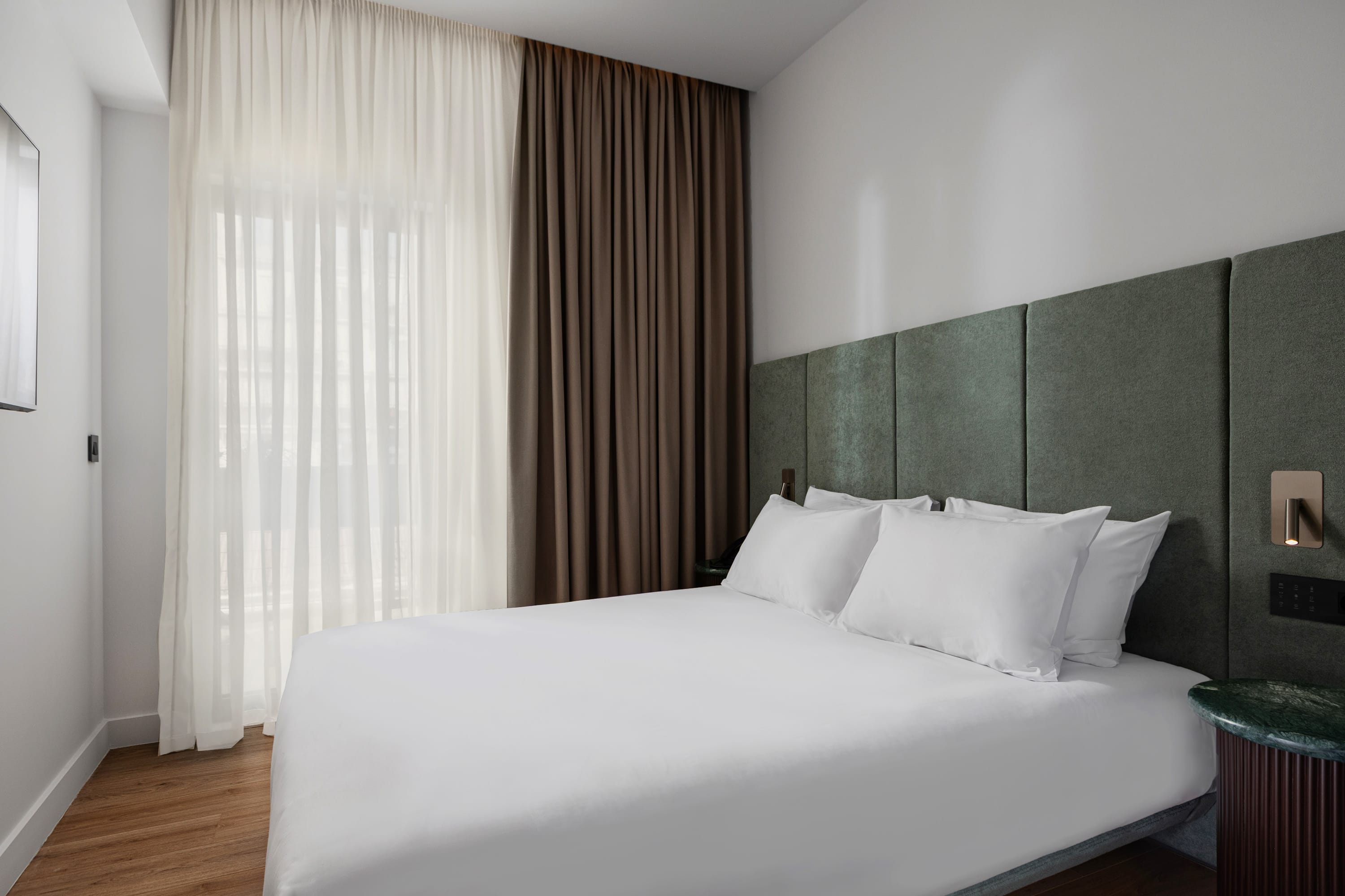 a bed with white sheets