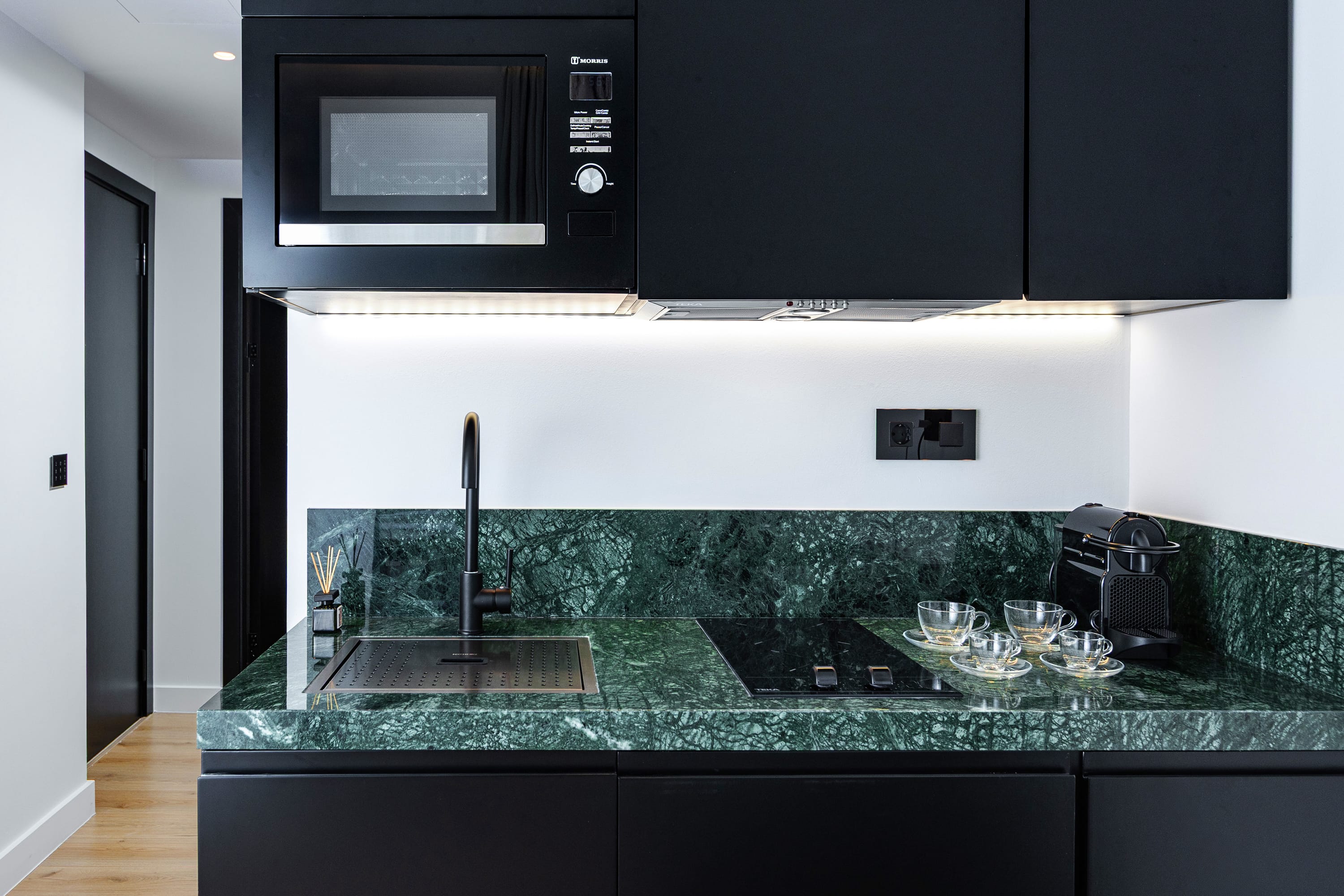 a kitchen with a large green countertop