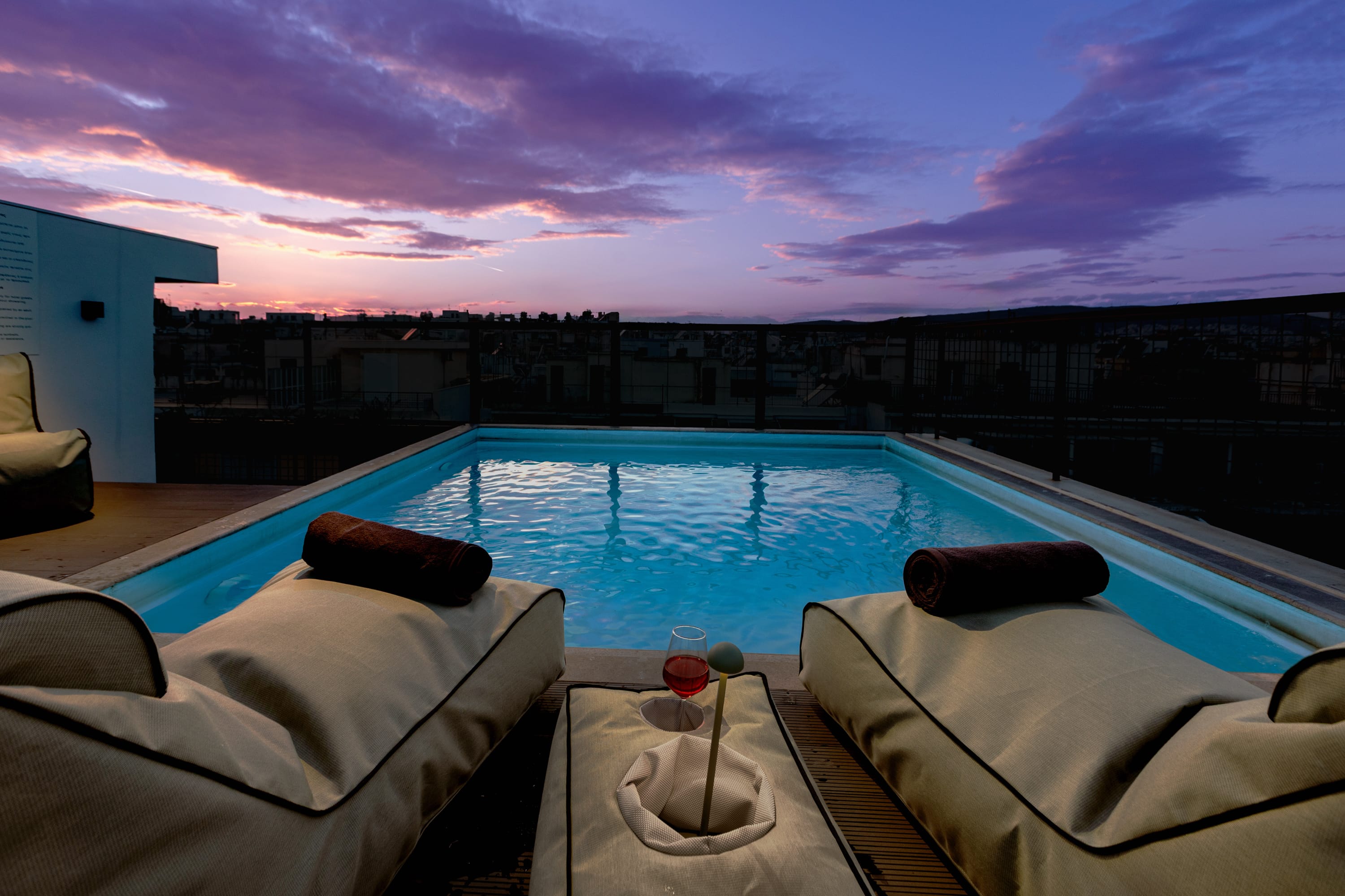 a pool with a view of the city and the ocean