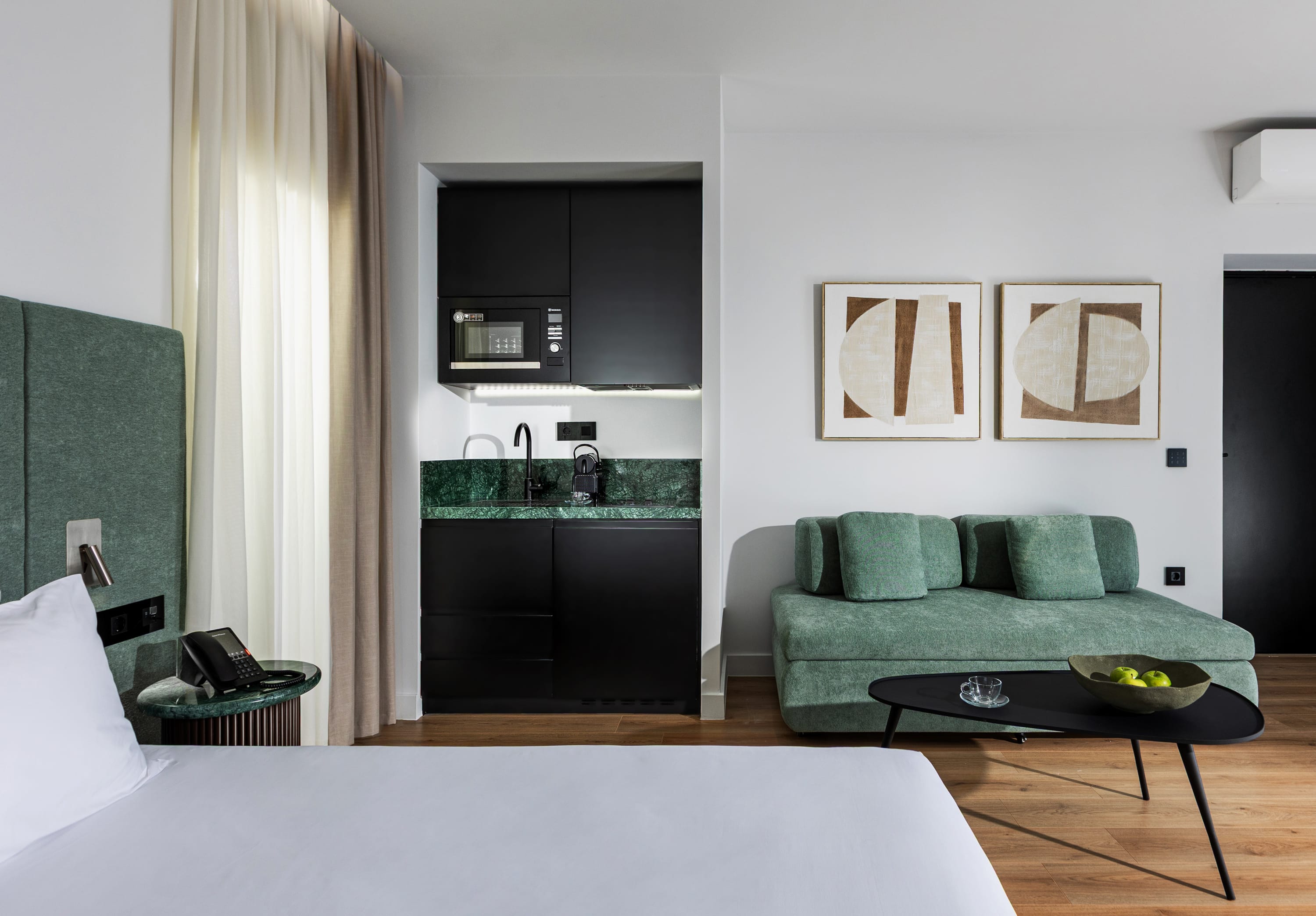 a living room with a green couch