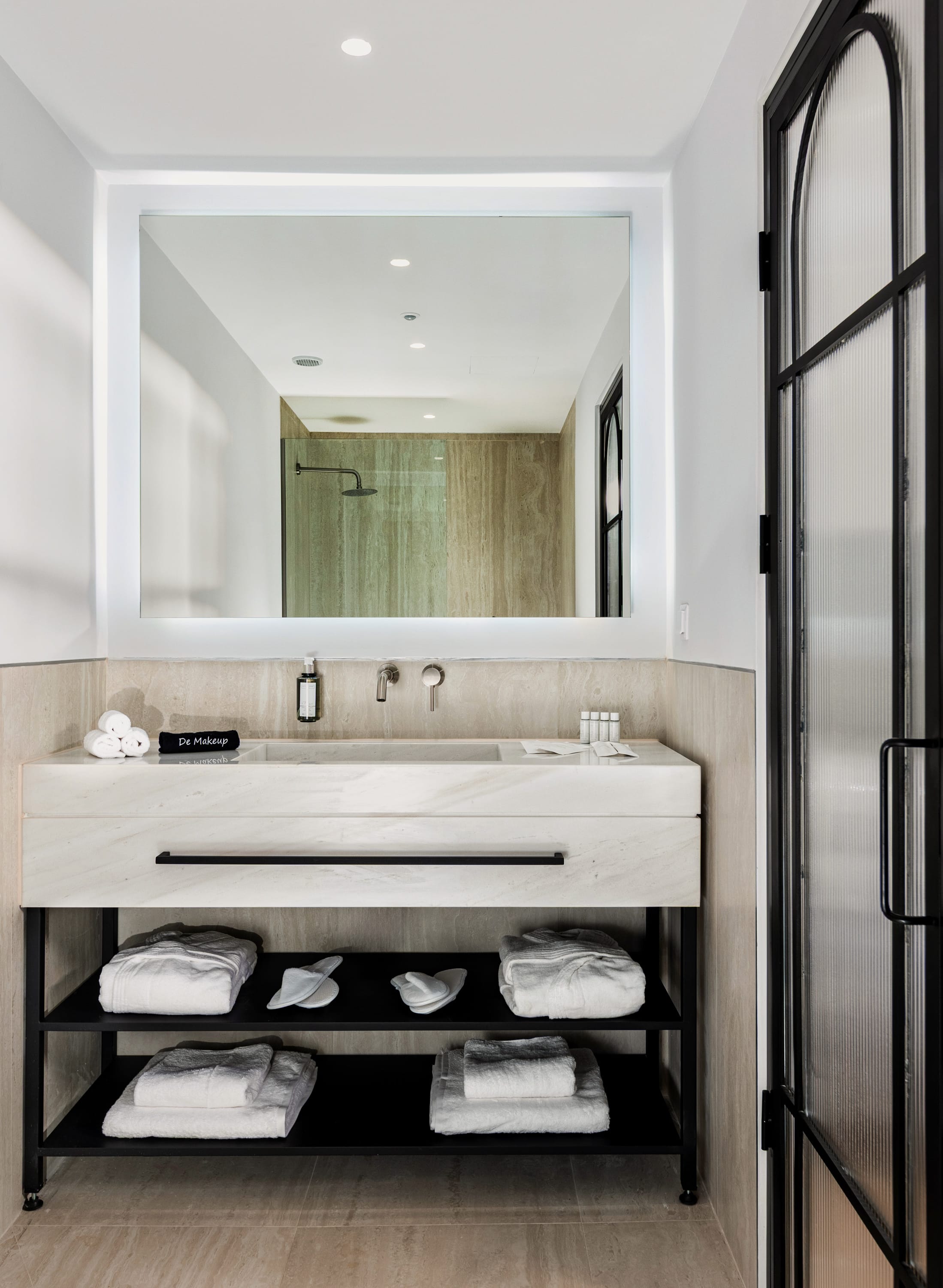 a bathroom with a large mirror