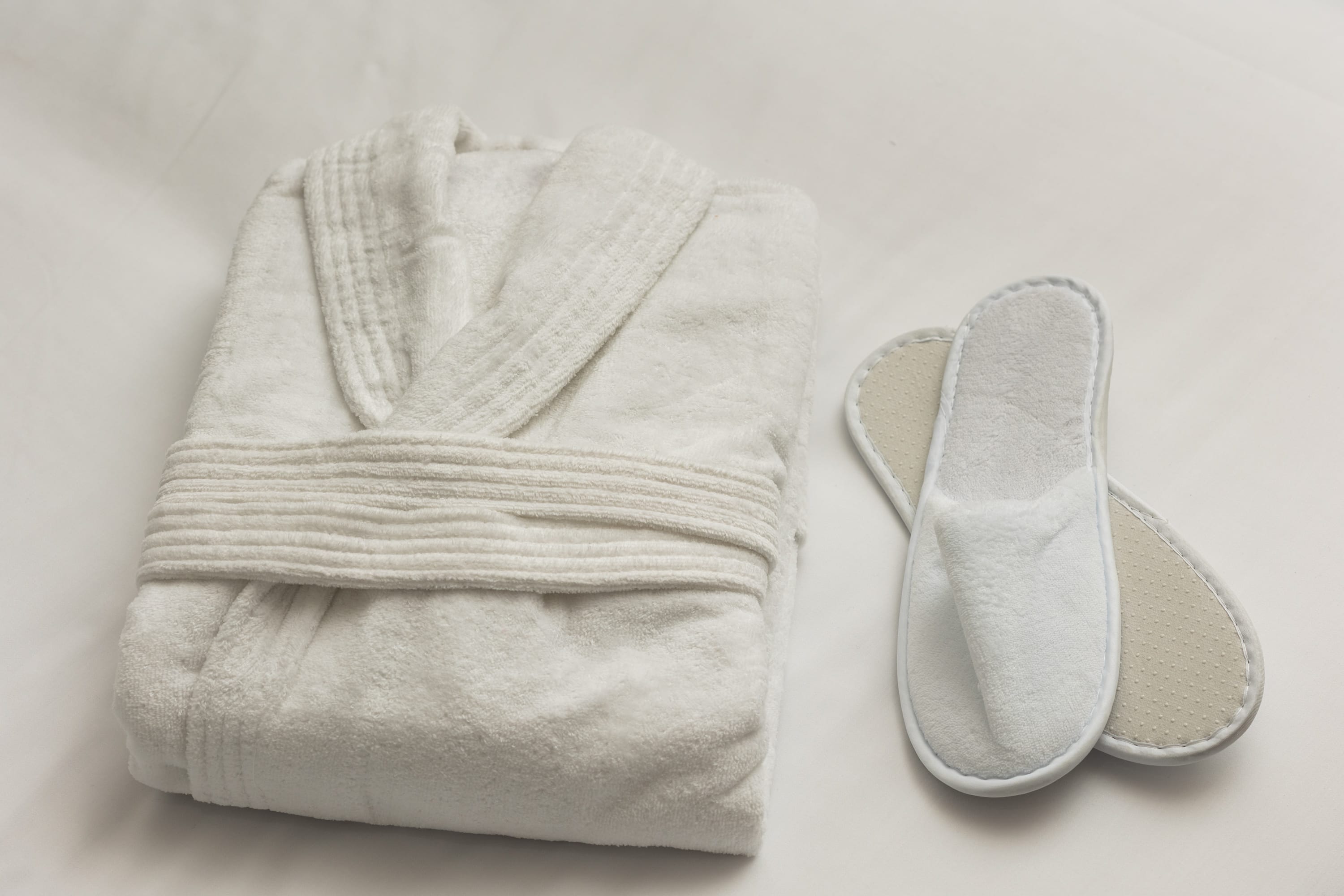 a pair of white slippers