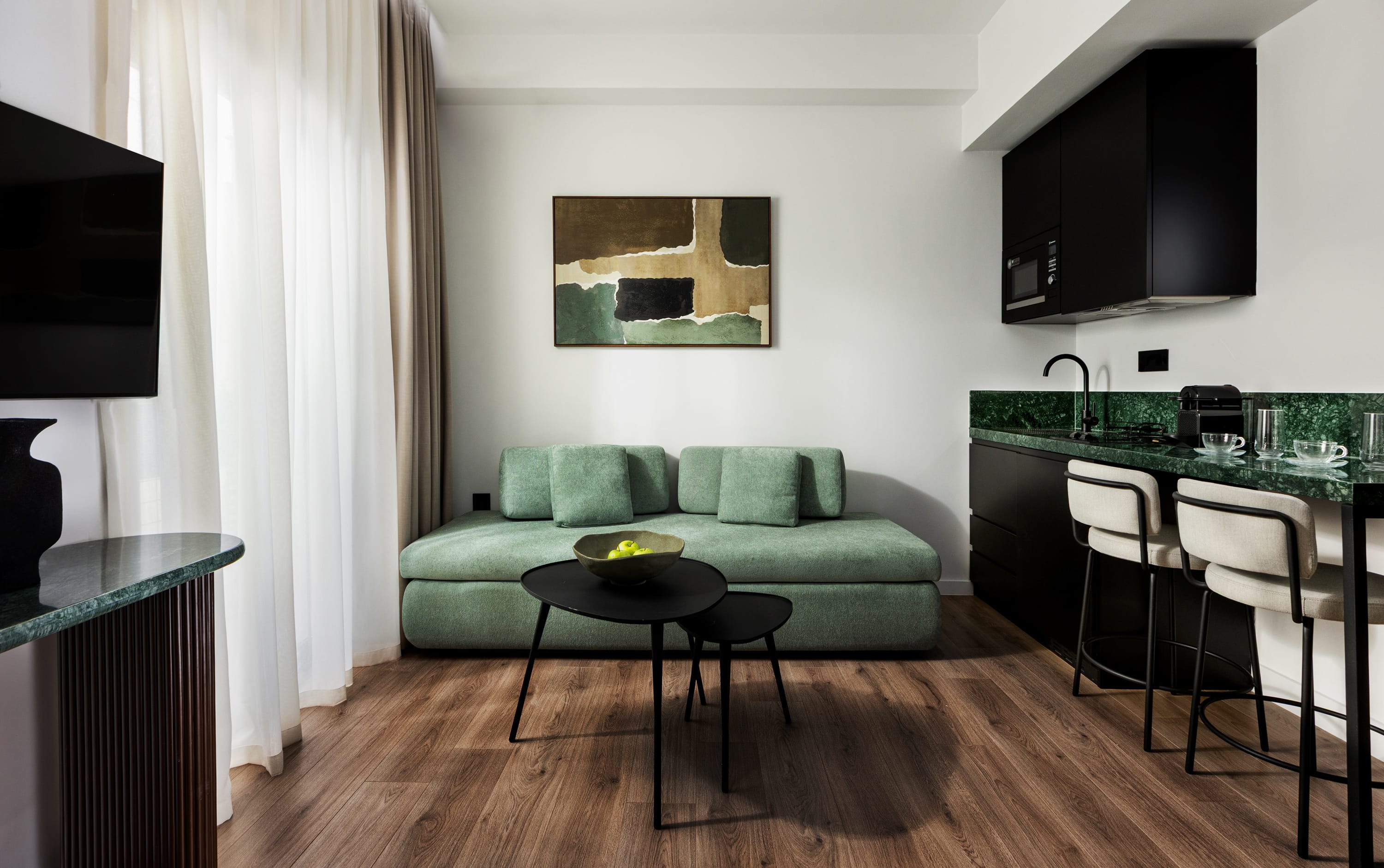 a living room with a green couch