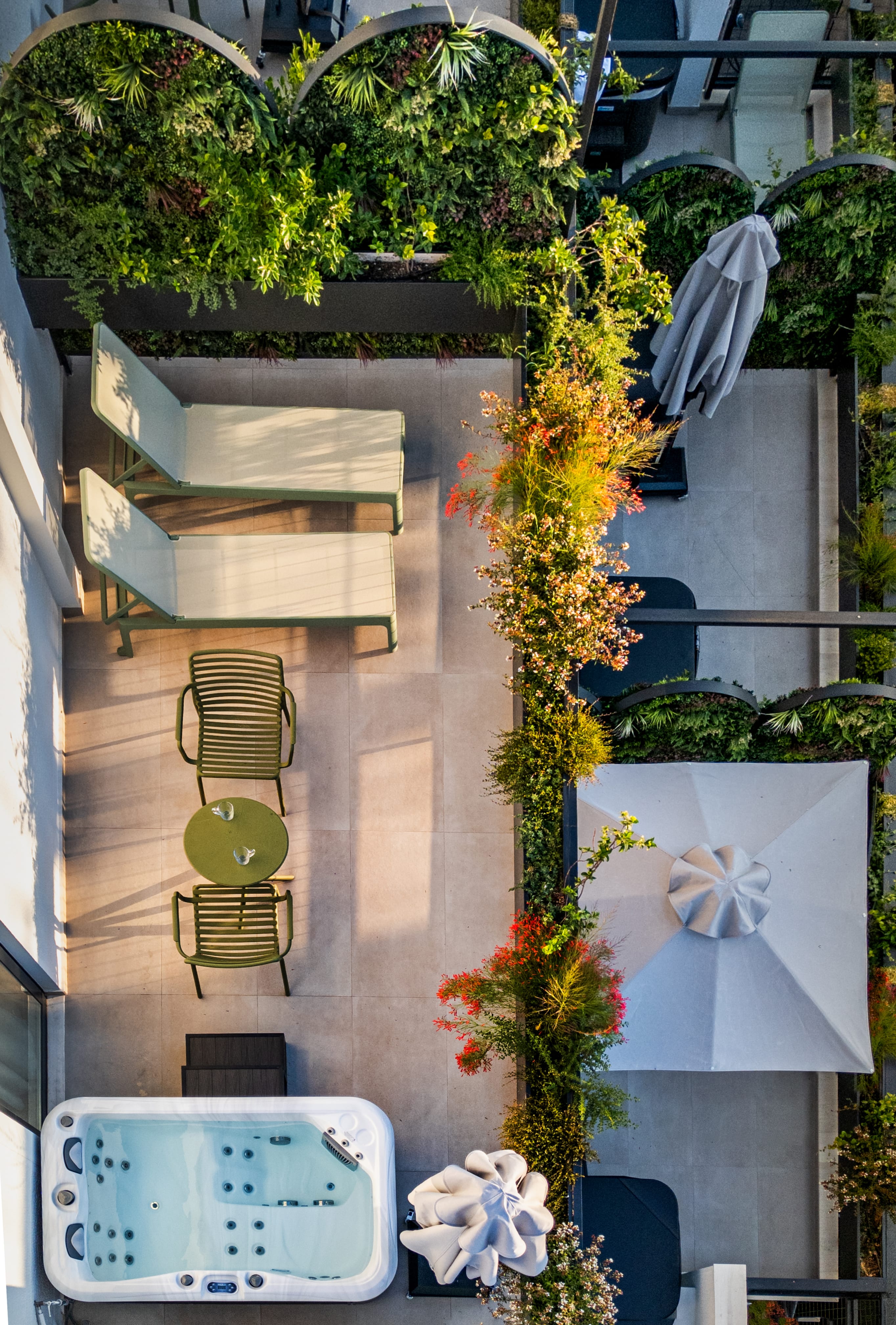 a patio area with chairs and umbrellas