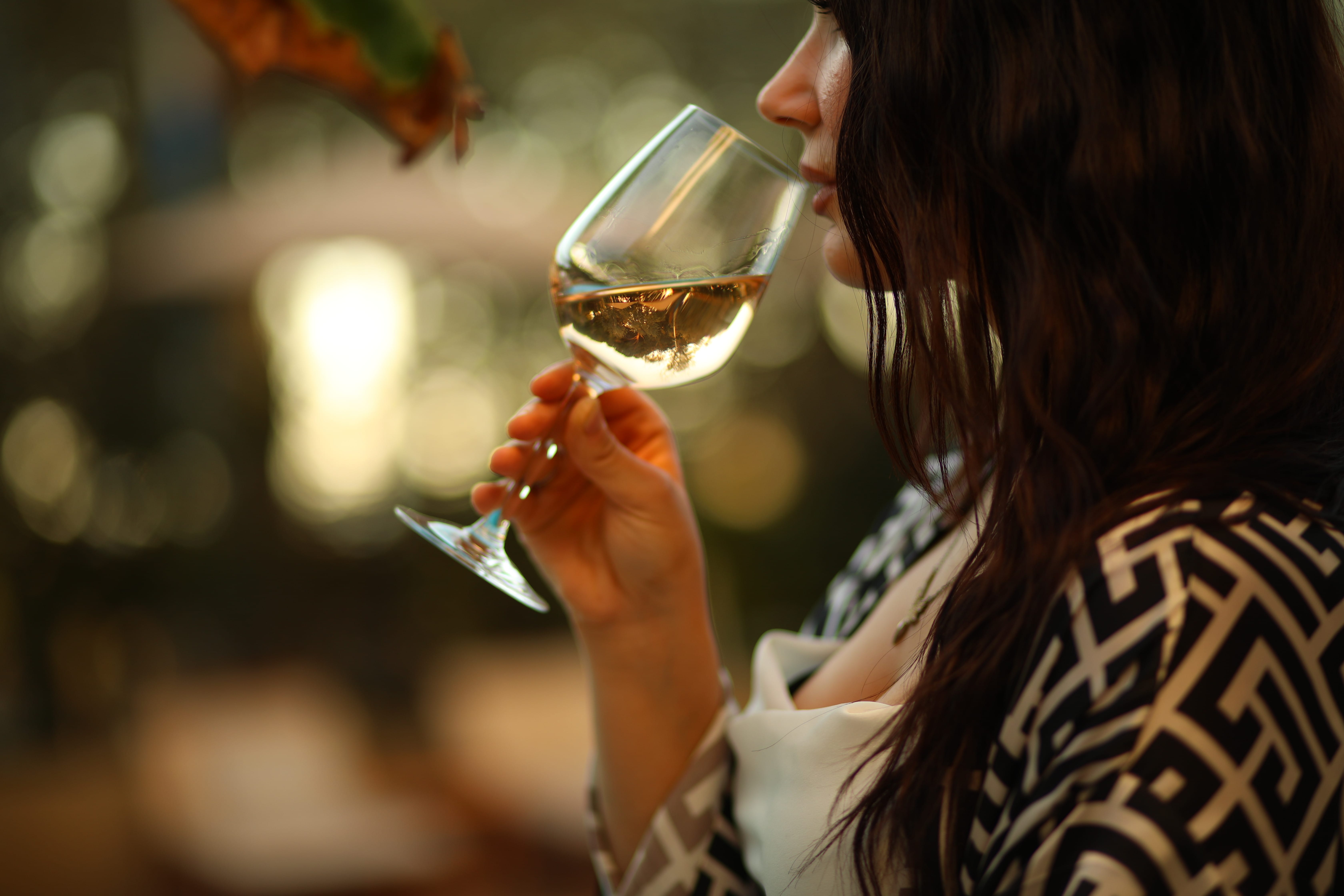 a woman drinking wine