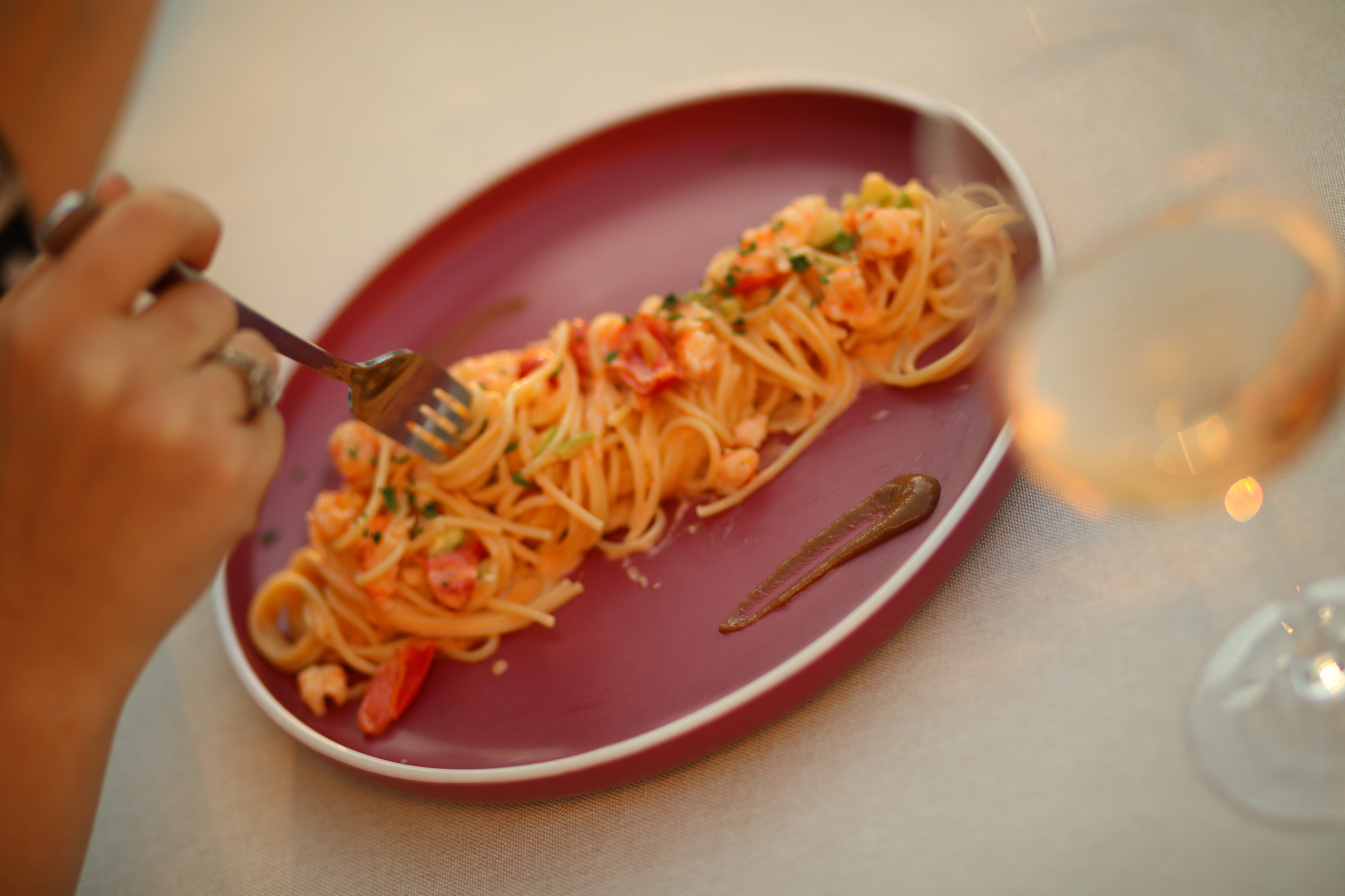 a plate of spaghetti and a fork