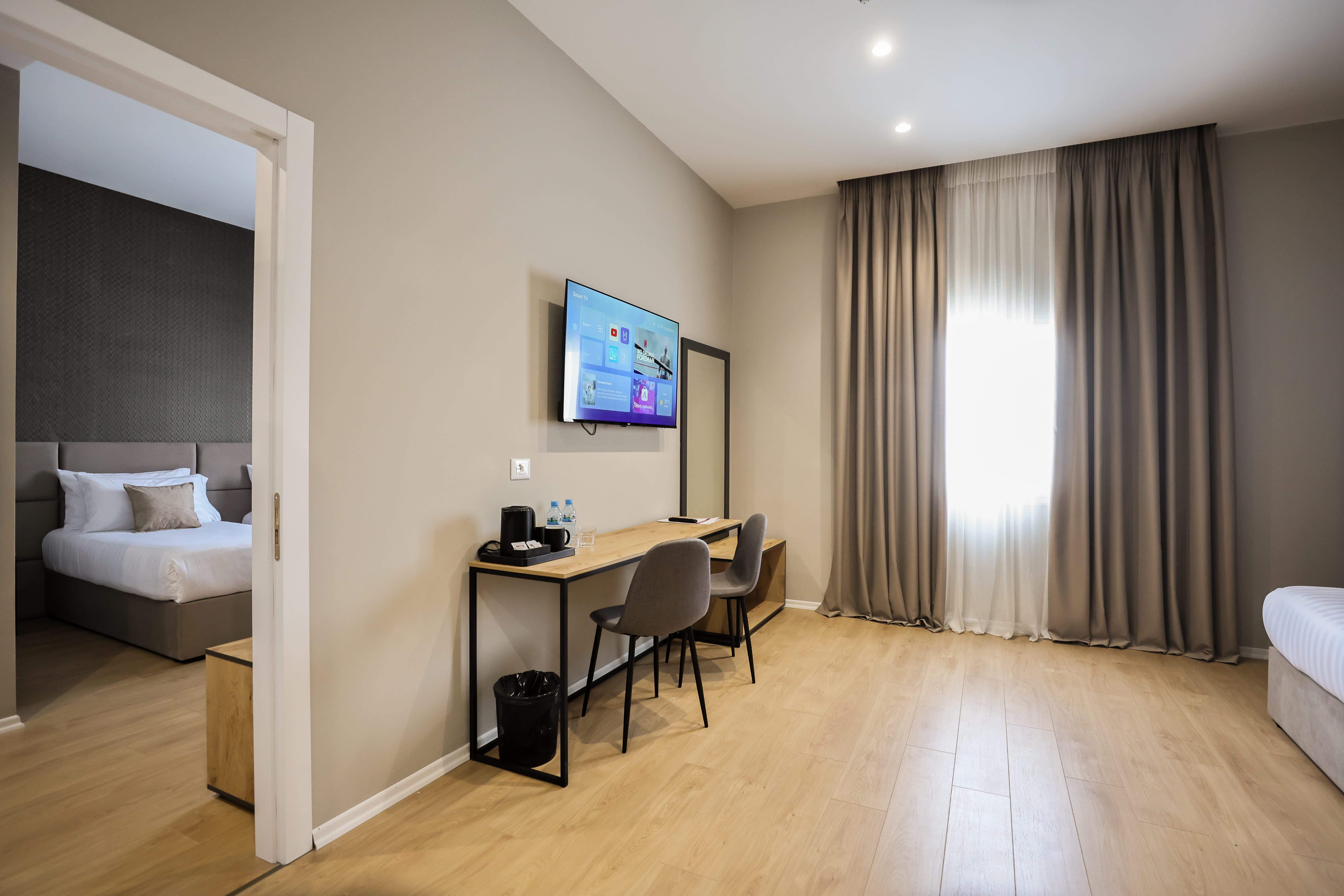 a room with a desk and a television