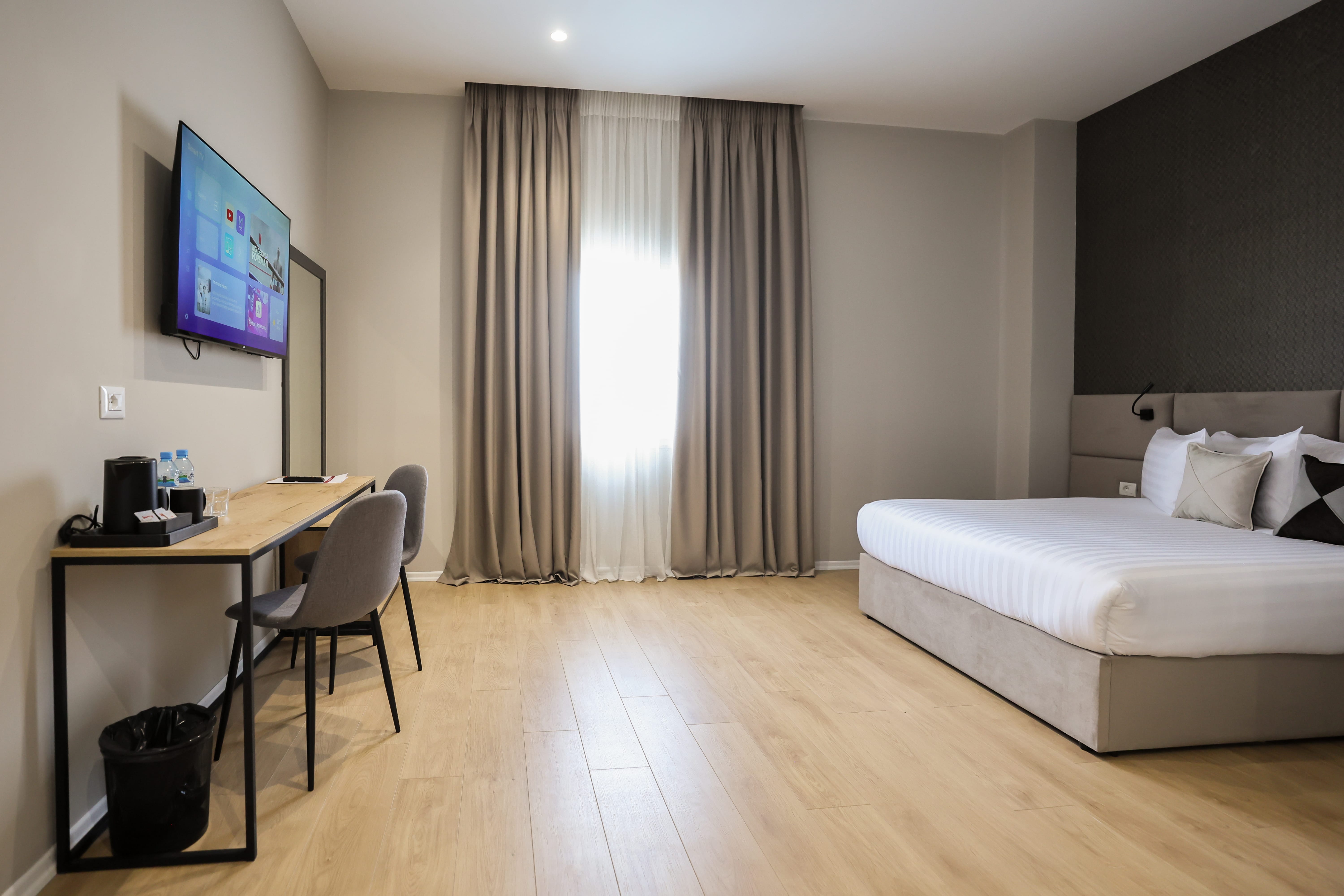 a room with a bed and a desk
