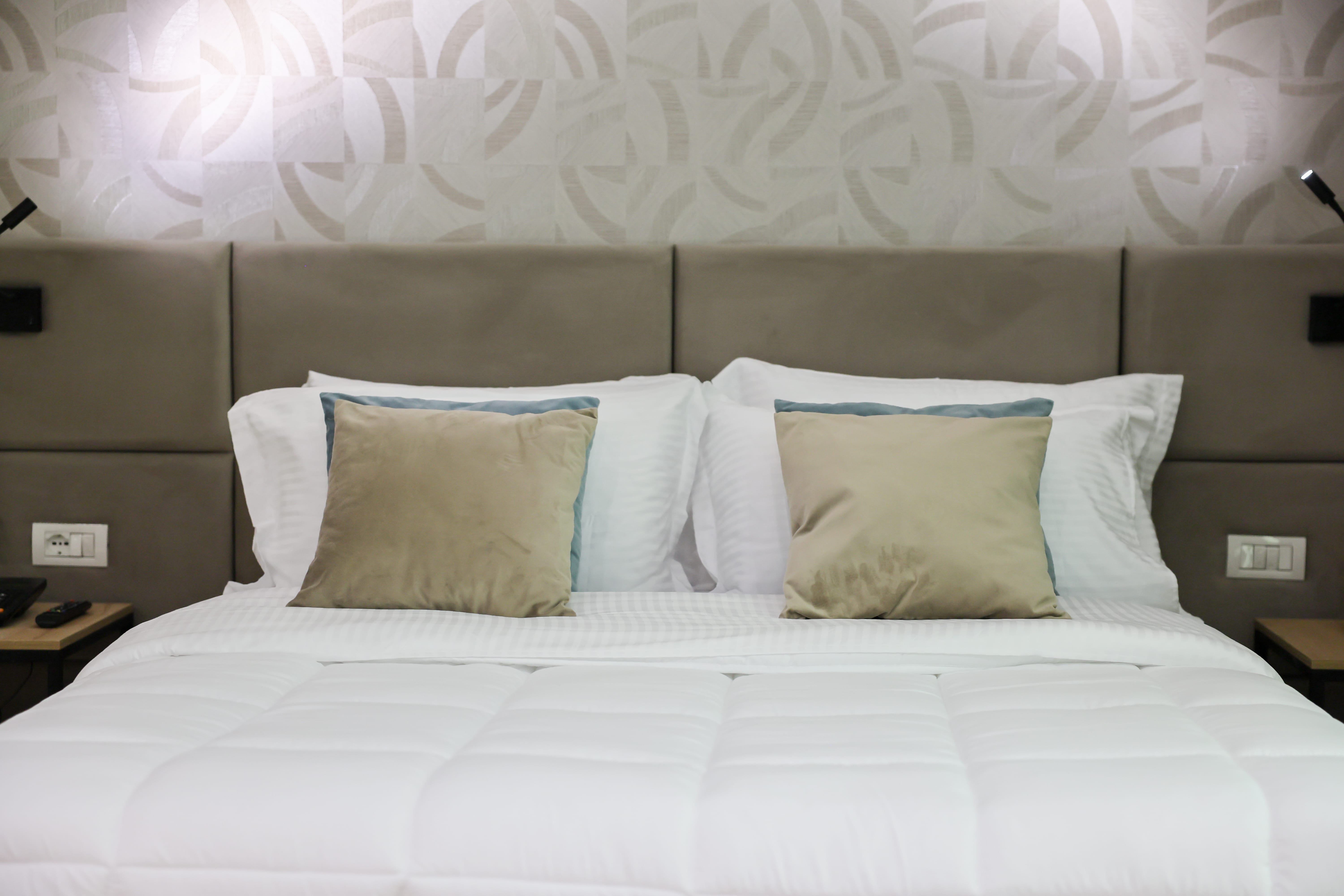 a bed with white pillows