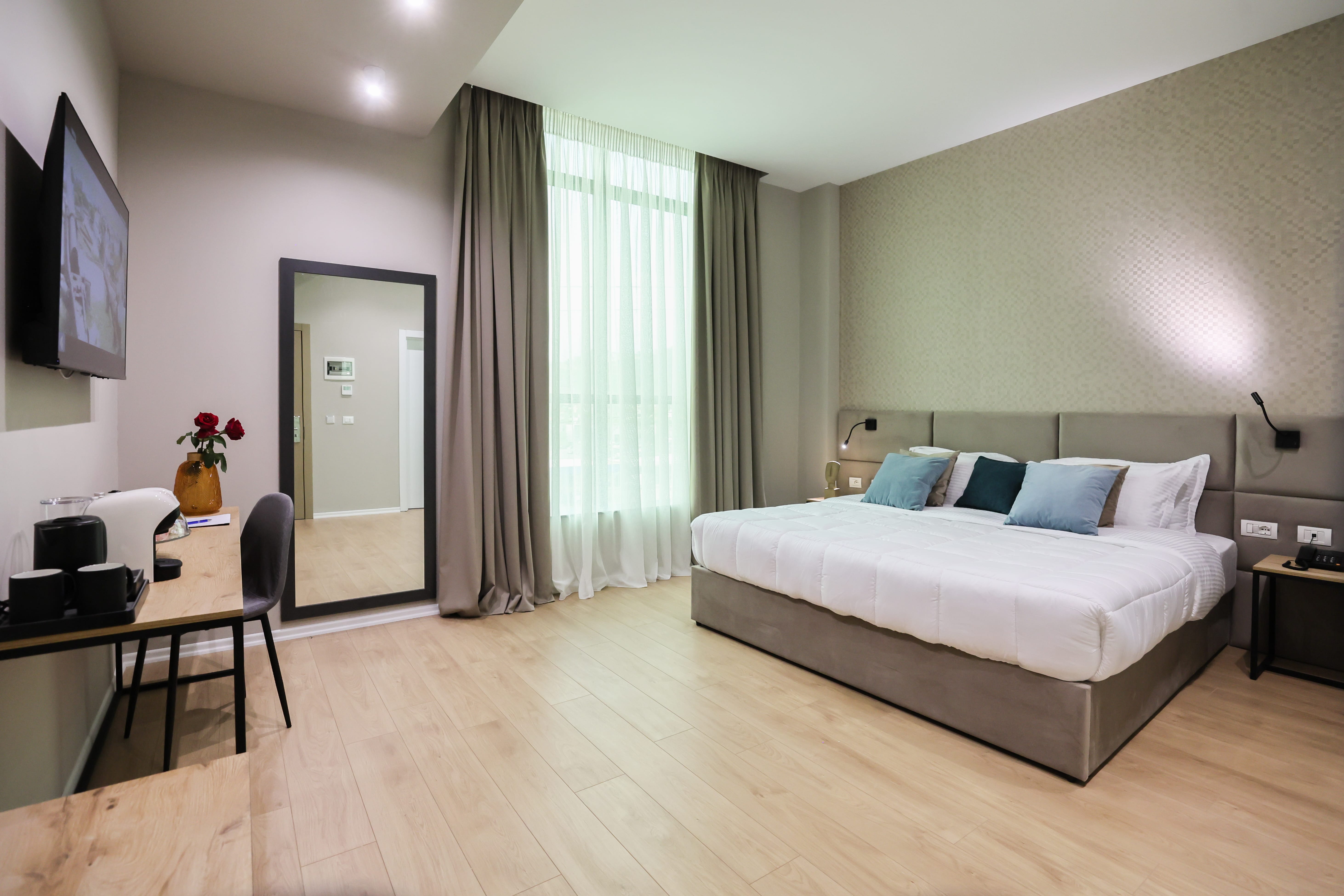 a bedroom with a bed and a desk