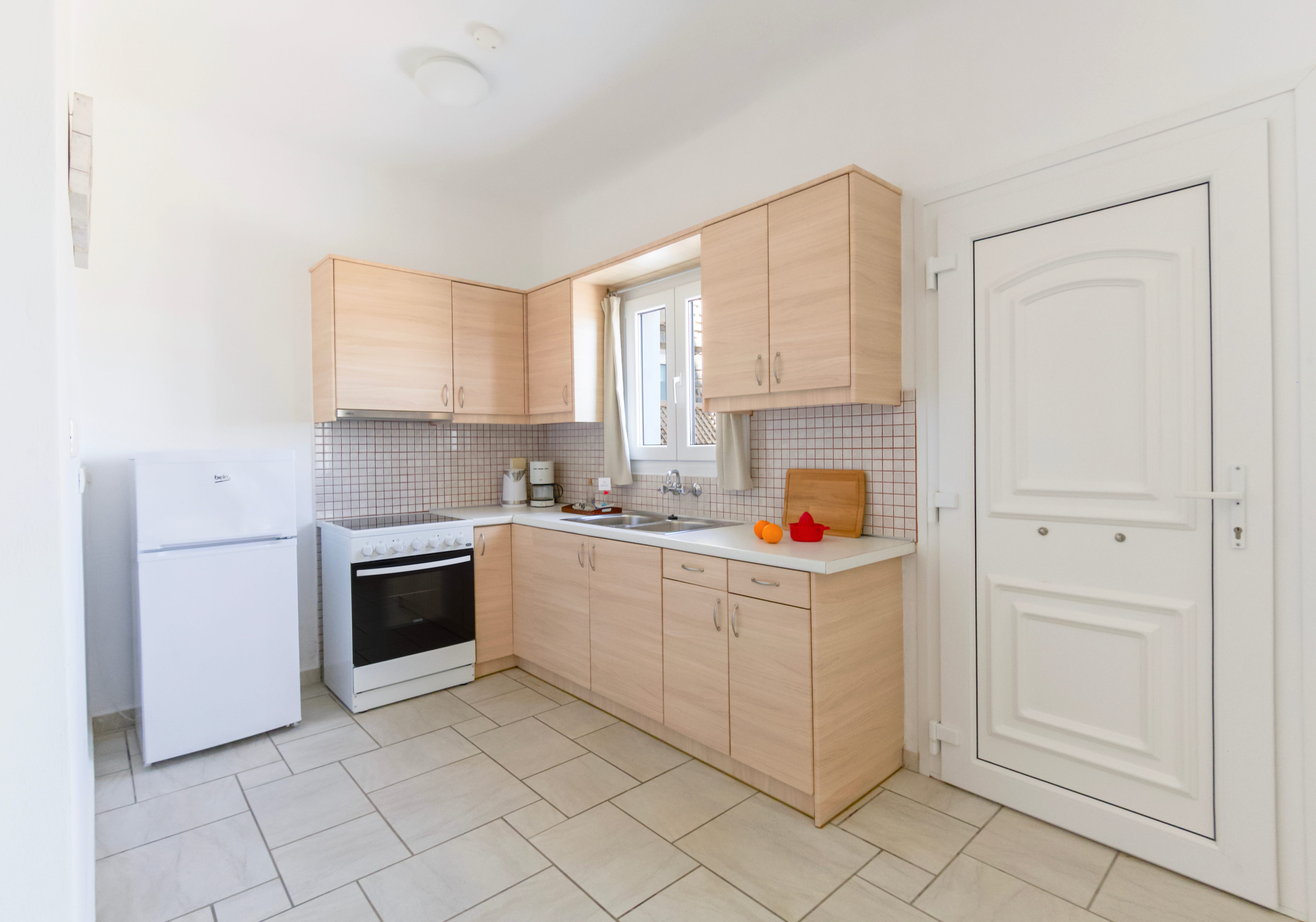 a kitchen with white cabinets