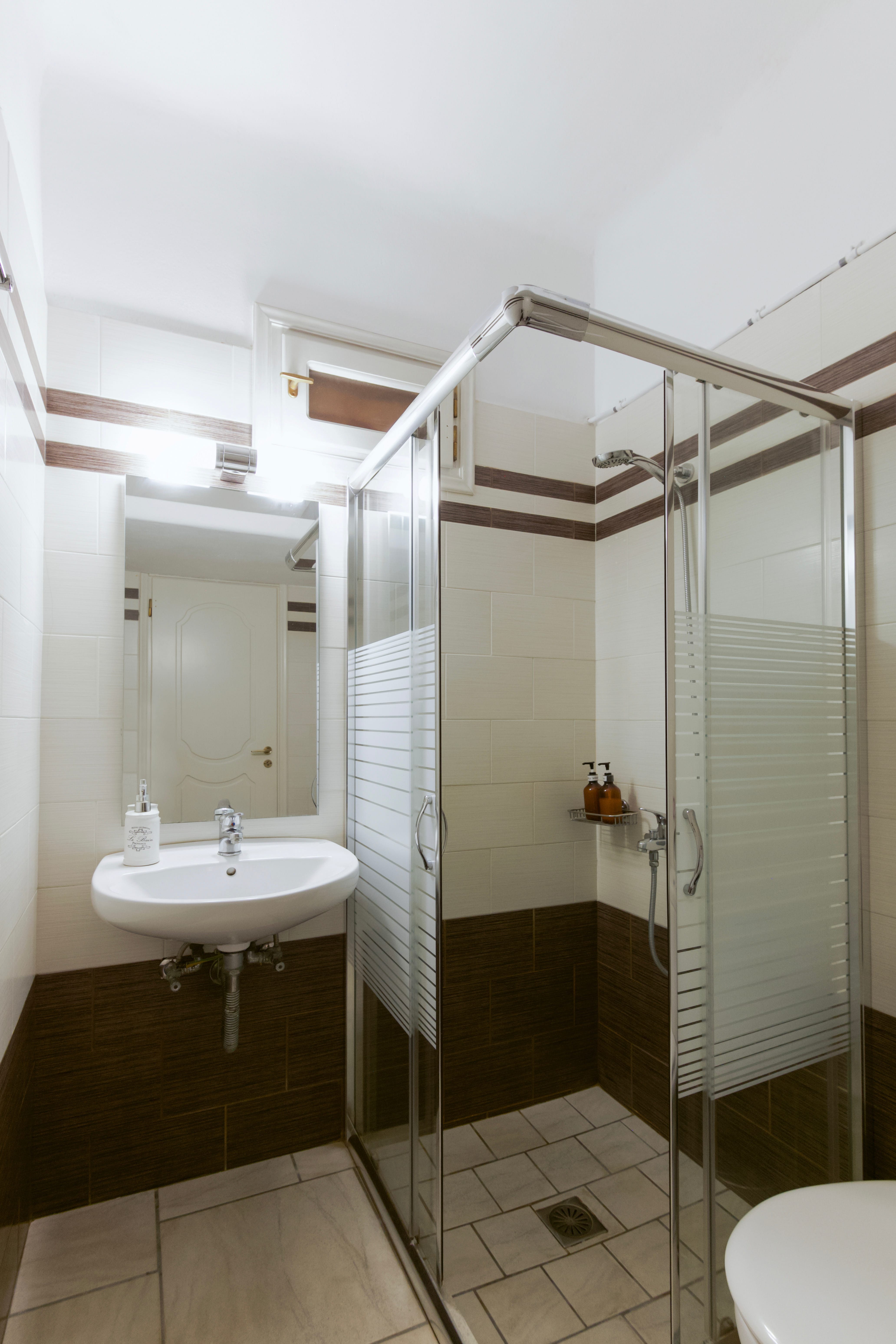 a bathroom with a glass shower