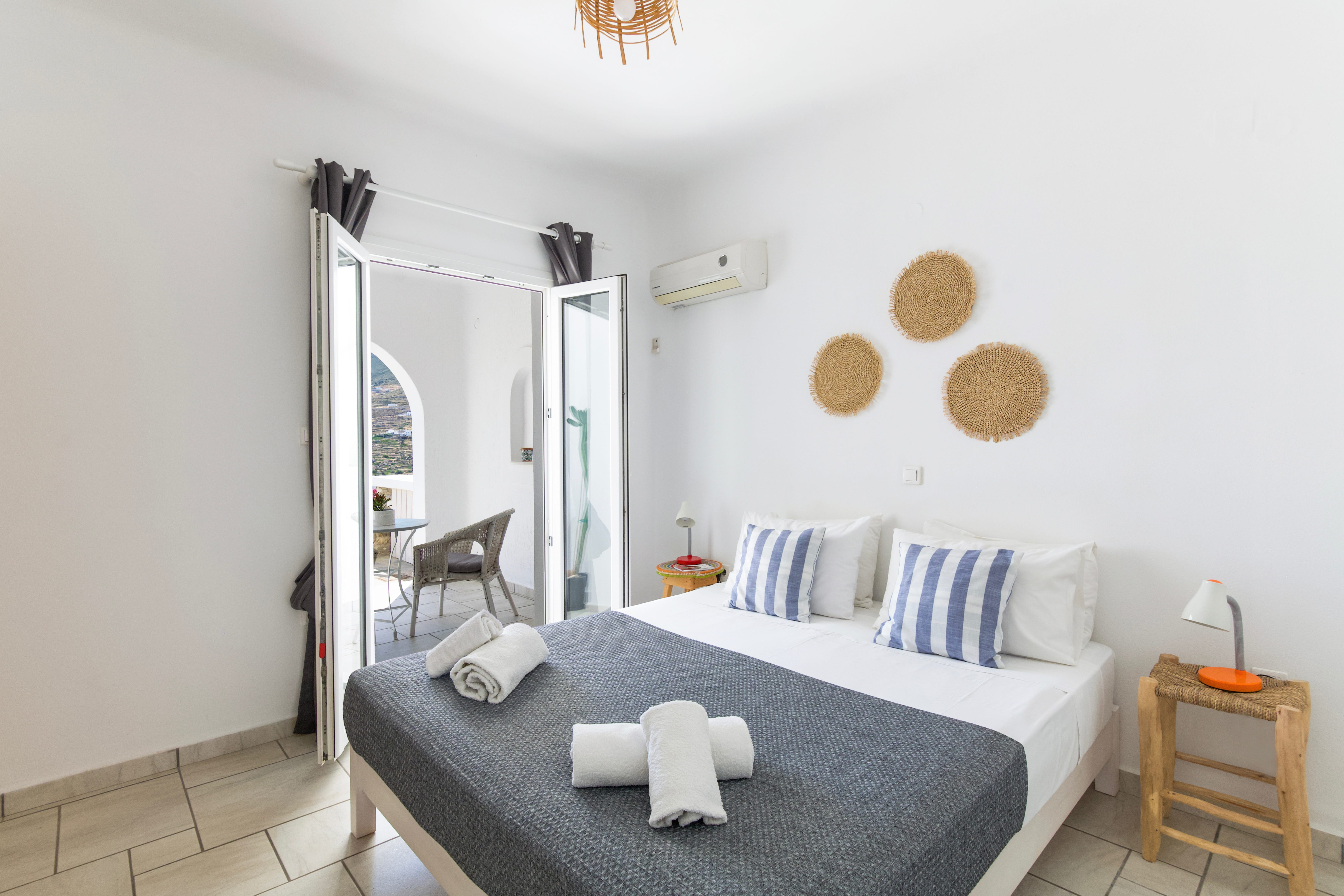 a bed with white sheets
