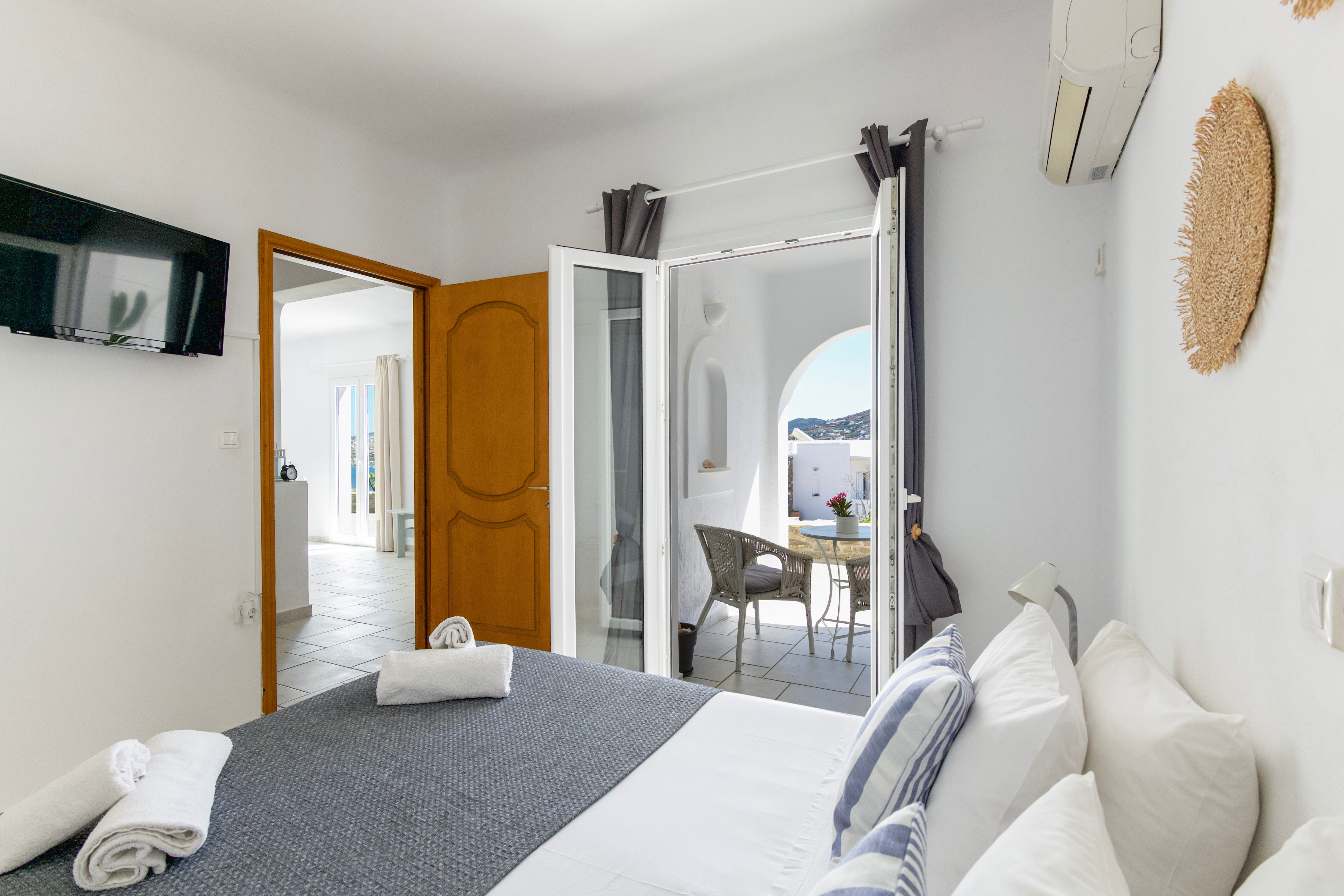 a bedroom with a bed and a mirror
