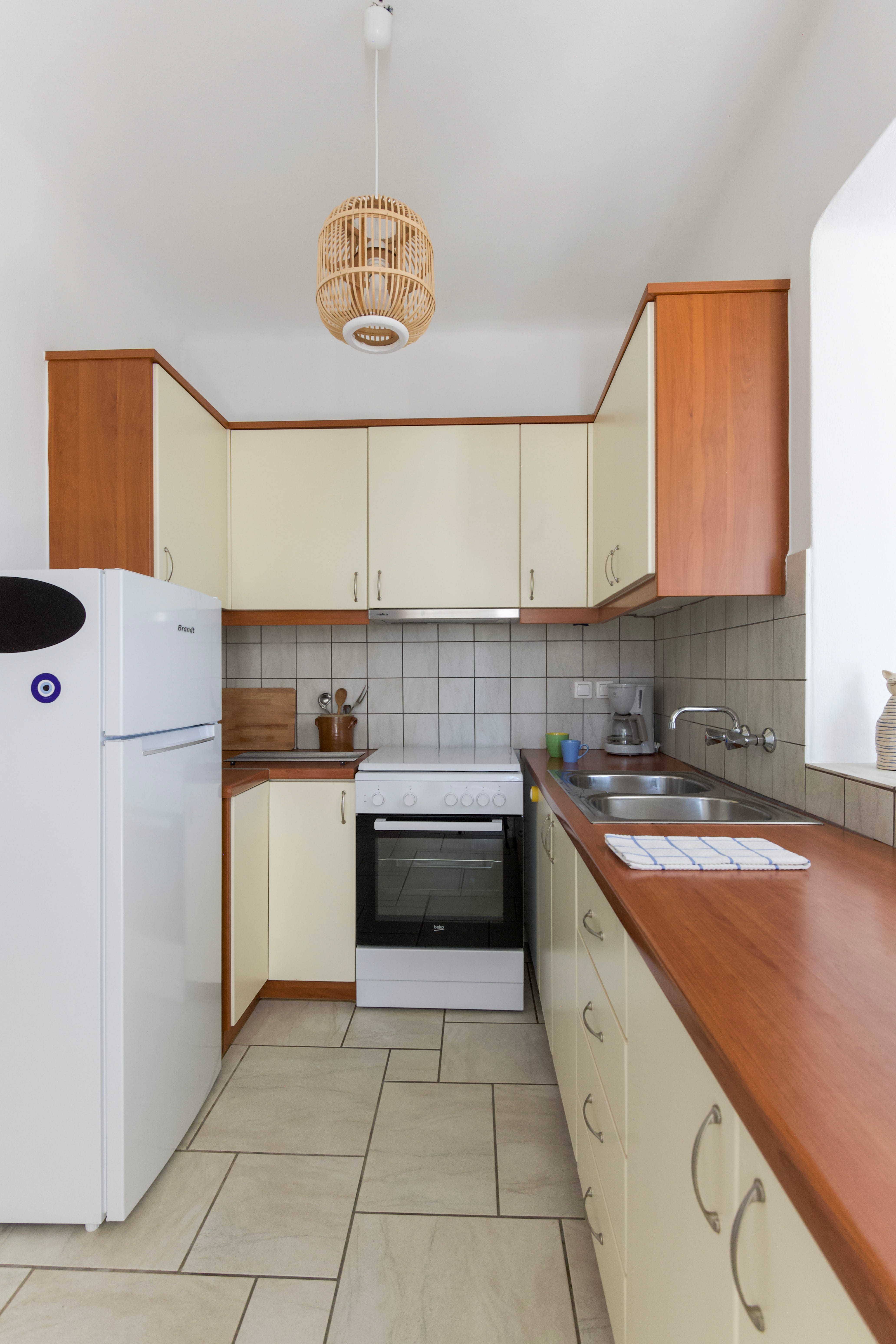 a kitchen with white cabinets