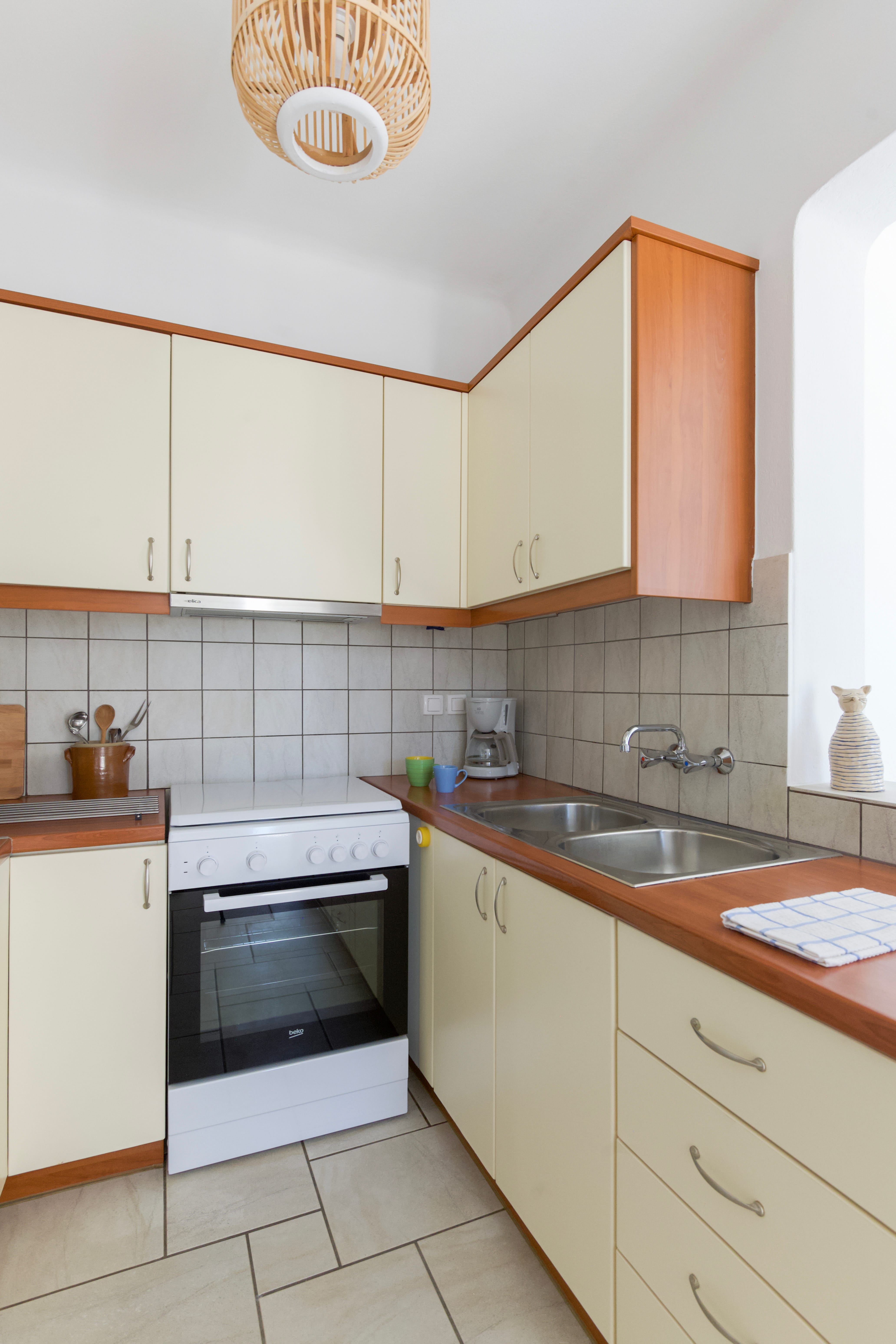a kitchen with white cabinets