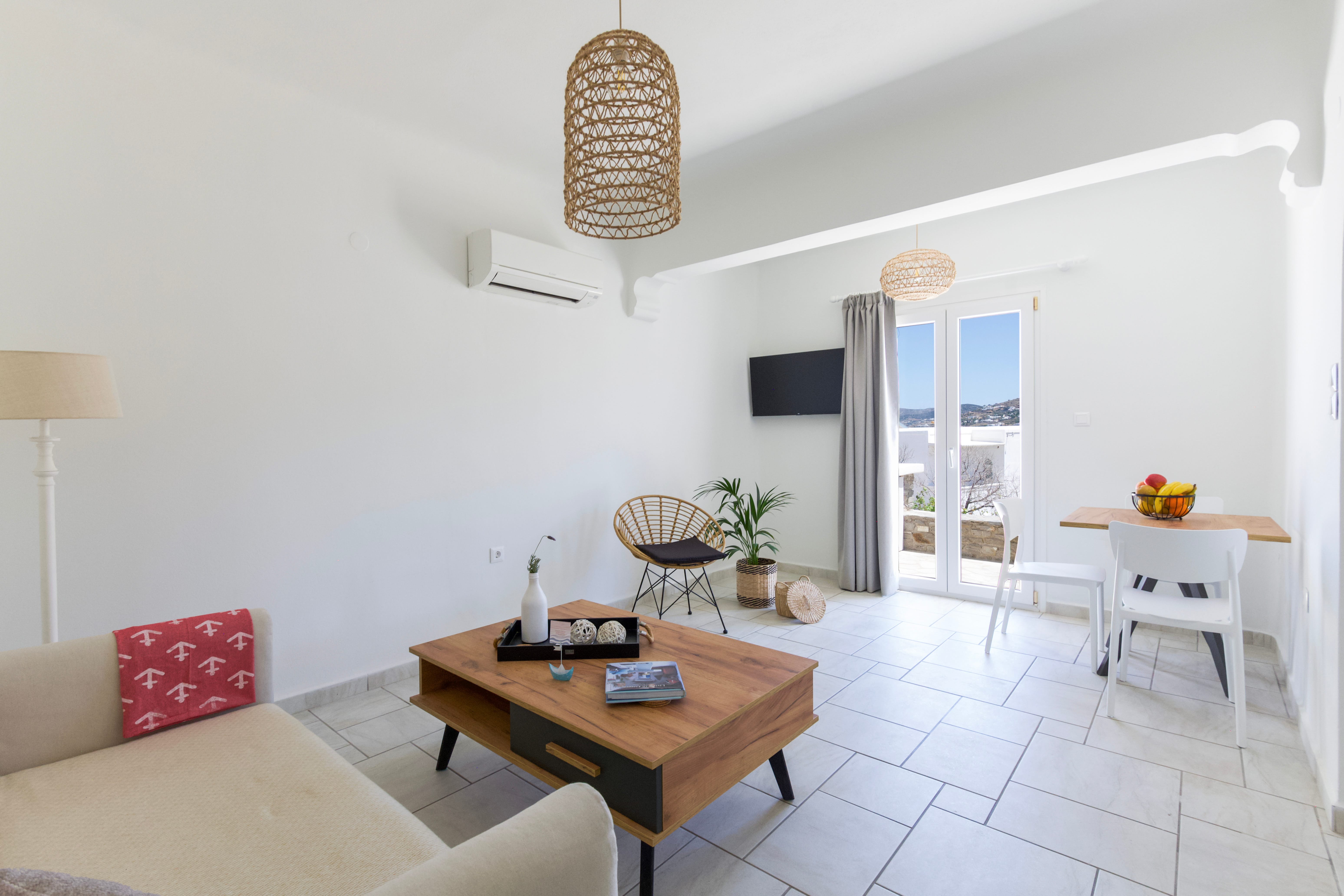 a living room with a table and chairs