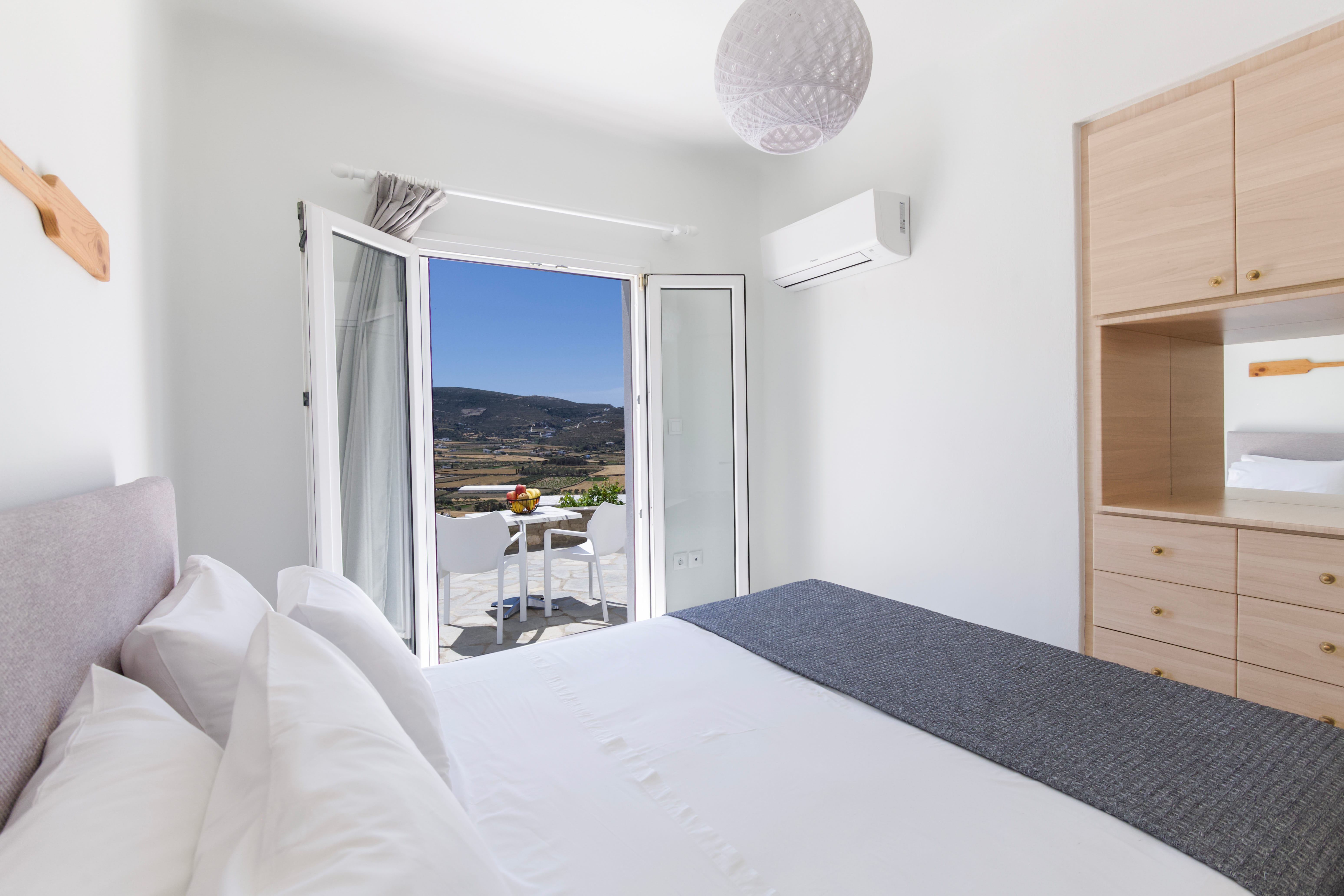 a room with a bed and a window