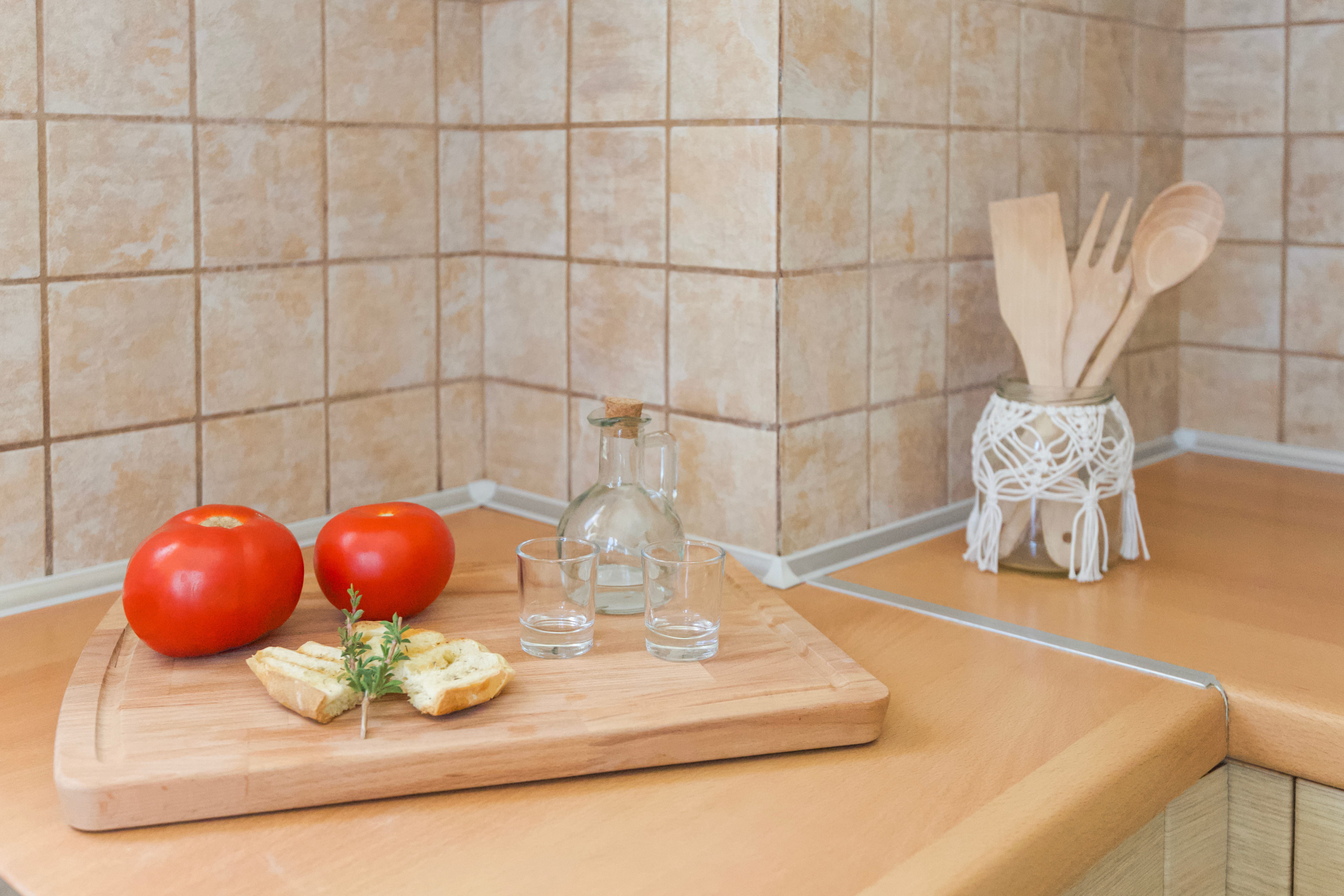 tomatoes and cheese on a cutting board