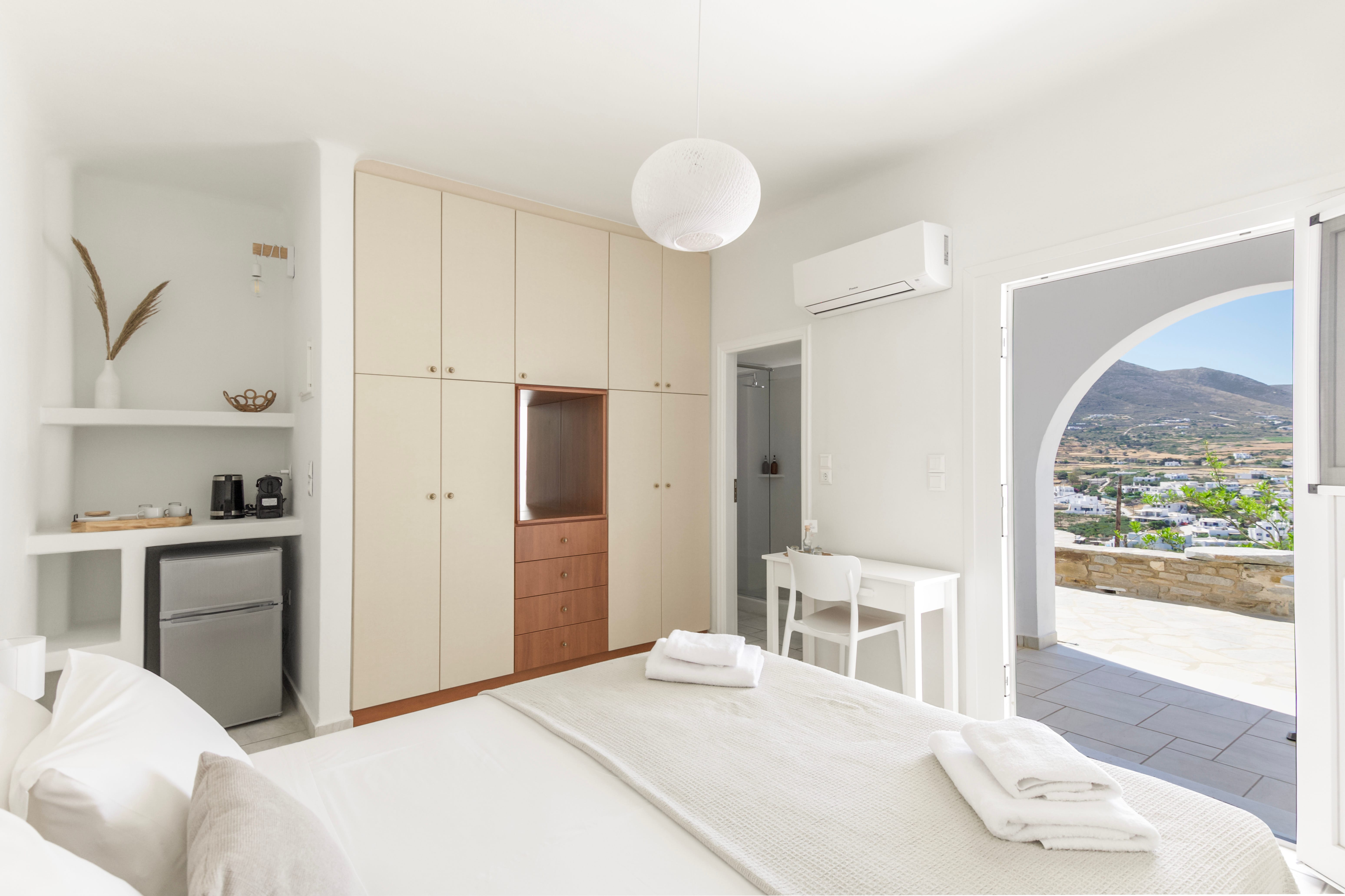 a bedroom with a large window